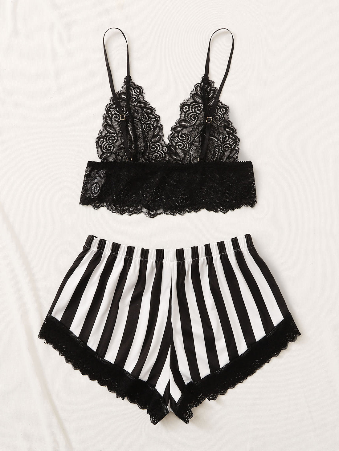 Black and white 2-piece lingerie set featuring a floral lace bralette with adjustable spaghetti straps and scallop trim, paired with striped low-rise boyshorts with slight stretch and semi-sheer lace details.