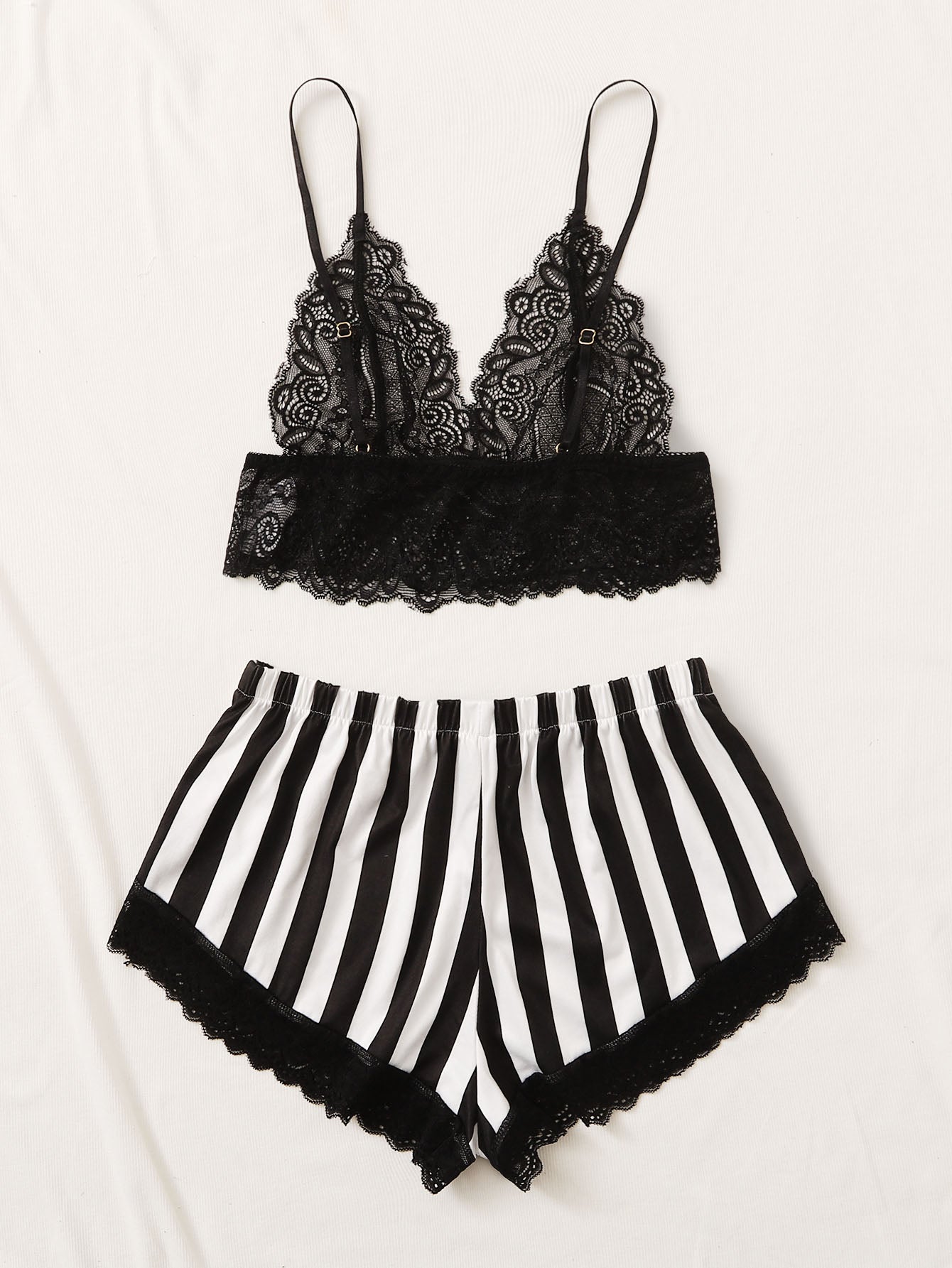 Black and white 2-piece lingerie set featuring a floral lace bralette with adjustable spaghetti straps and scallop trim, paired with striped low-rise boyshorts with slight stretch and semi-sheer lace details.