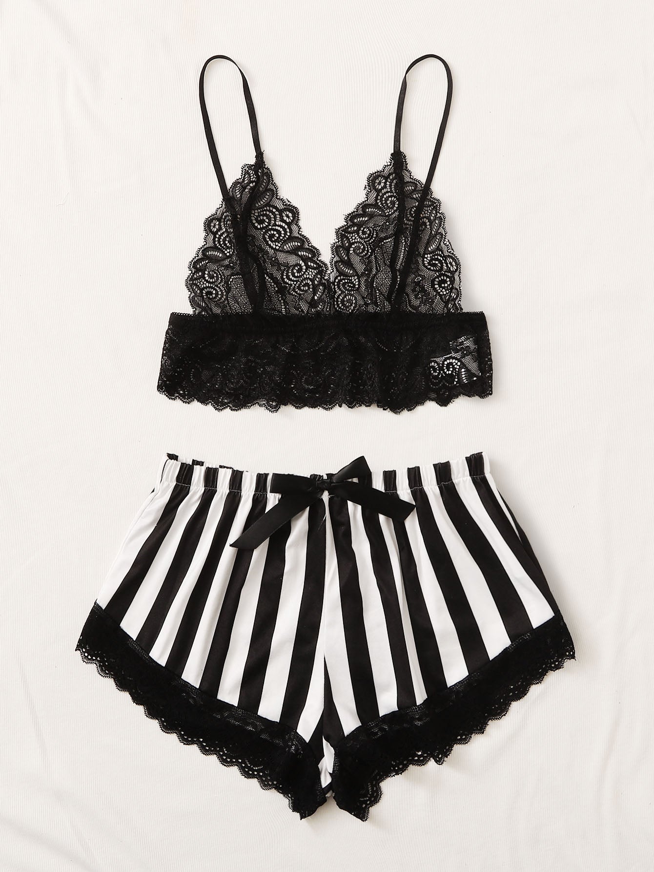 Black and white 2-piece lingerie set featuring a floral lace bralette with adjustable spaghetti straps and scallop trim, paired with striped low-rise boyshorts with slight stretch and semi-sheer lace details.