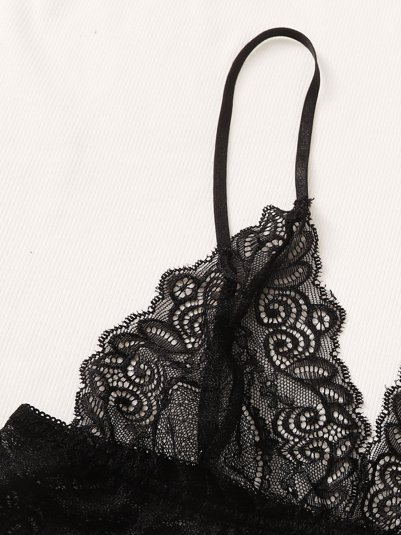Black and white 2-piece lingerie set featuring a floral lace bralette with adjustable spaghetti straps and scallop trim, paired with striped low-rise boyshorts with slight stretch and semi-sheer lace details.