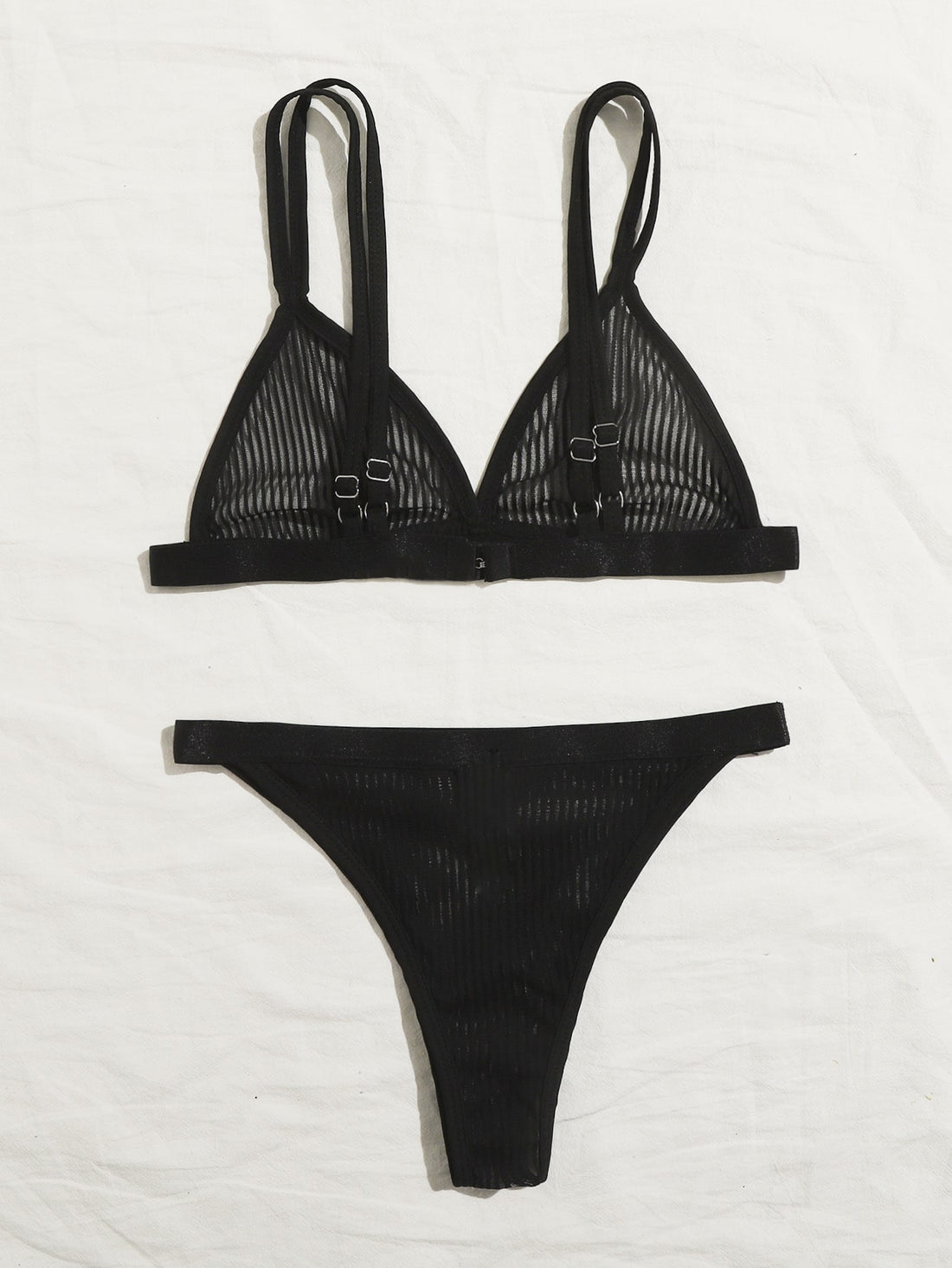 Women's black sheer mesh two-piece underwear set featuring a spaghetti strap bralette with adjustable straps and matching low-rise bikini panties.