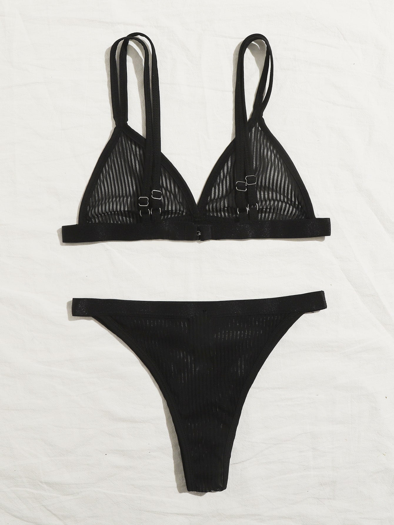 Women's black sheer mesh two-piece underwear set featuring a spaghetti strap bralette with adjustable straps and matching low-rise bikini panties.