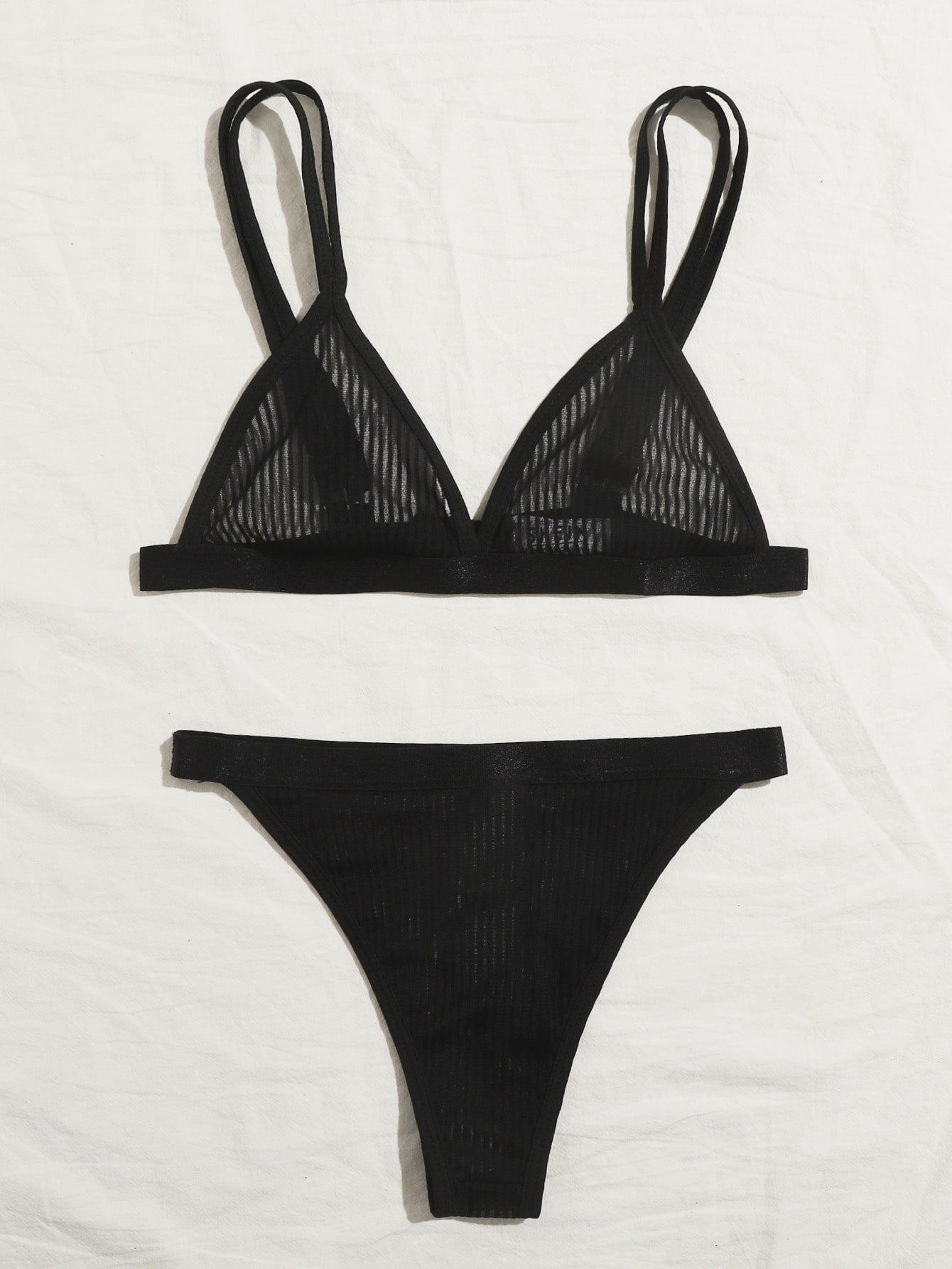 Women's black sheer mesh two-piece underwear set featuring a spaghetti strap bralette with adjustable straps and matching low-rise bikini panties.