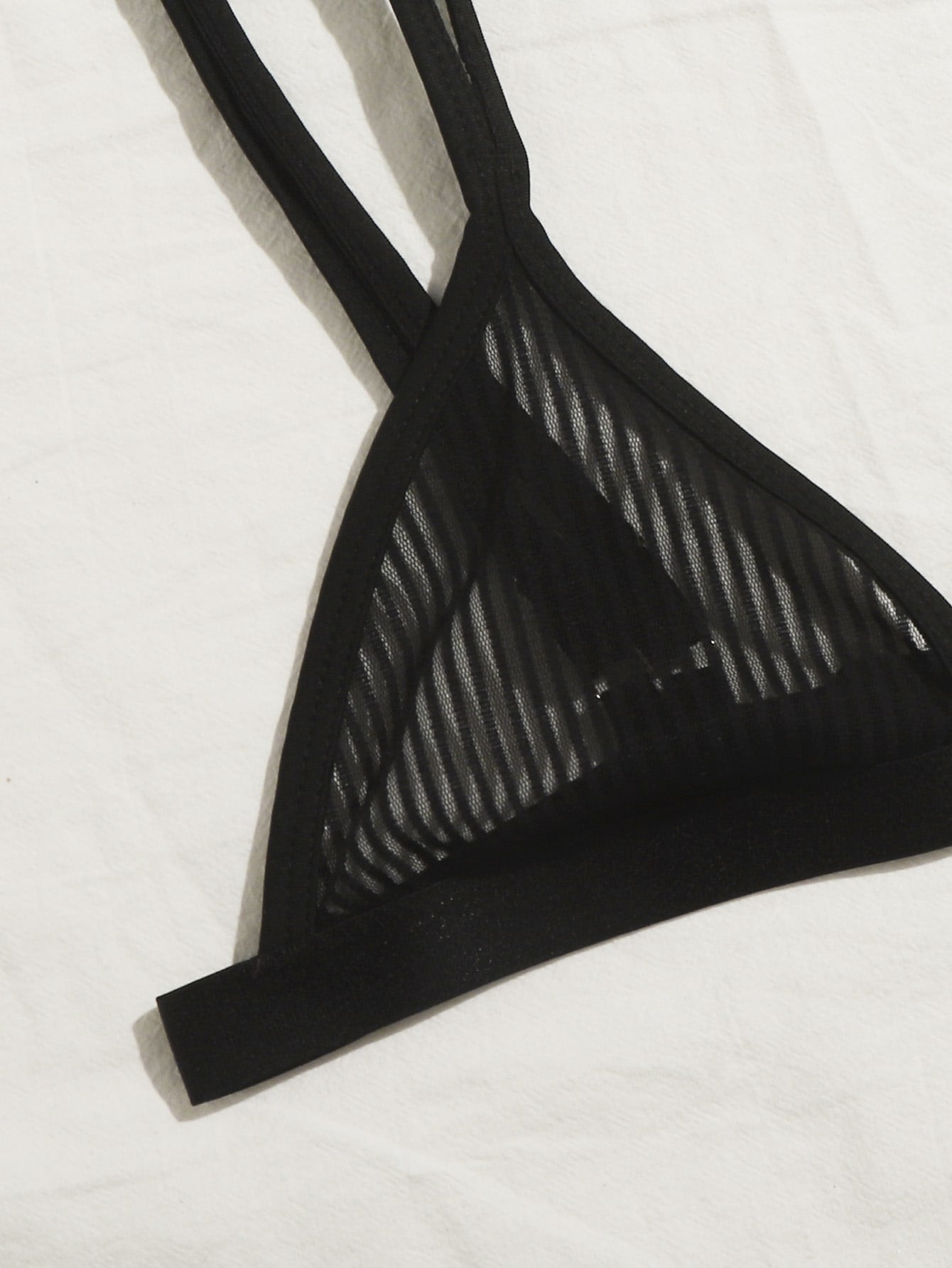 Women's black sheer mesh two-piece underwear set featuring a spaghetti strap bralette with adjustable straps and matching low-rise bikini panties.