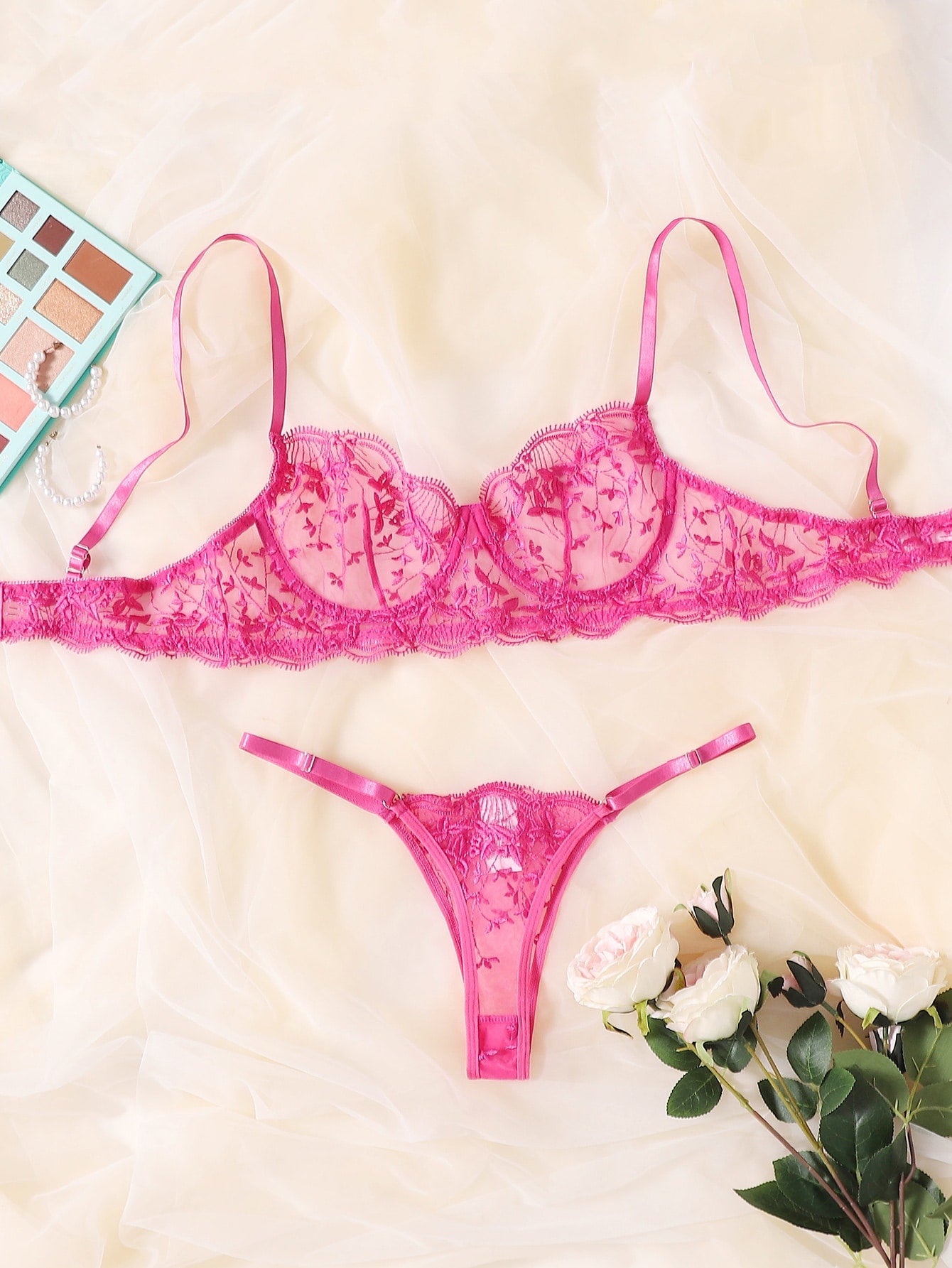 Two-piece embroidered mesh lingerie set featuring an underwire bra with adjustable spaghetti straps and matching low-rise thong, with contrast lace details and a semi-sheer finish.