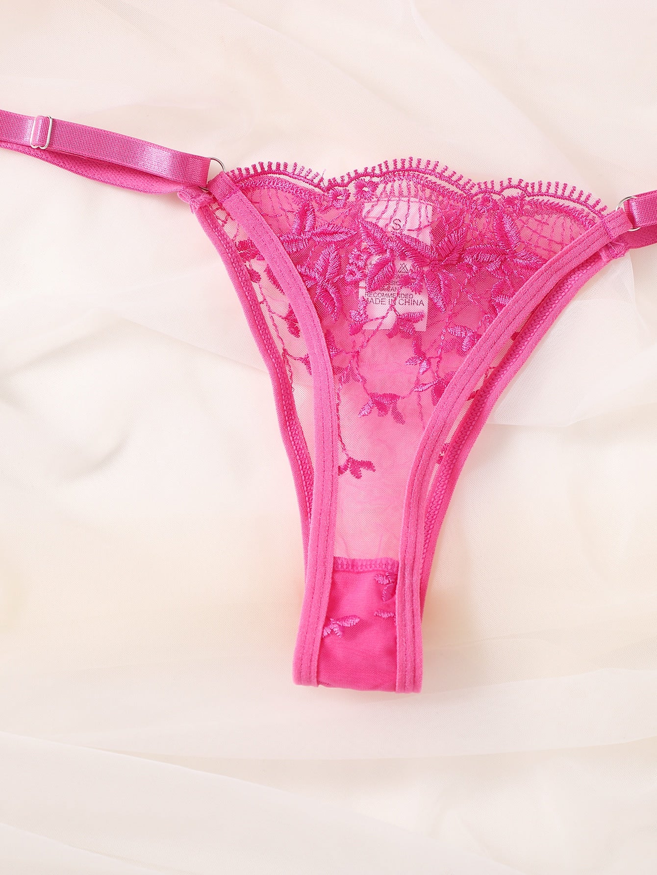 Two-piece embroidered mesh lingerie set featuring an underwire bra with adjustable spaghetti straps and matching low-rise thong, with contrast lace details and a semi-sheer finish.