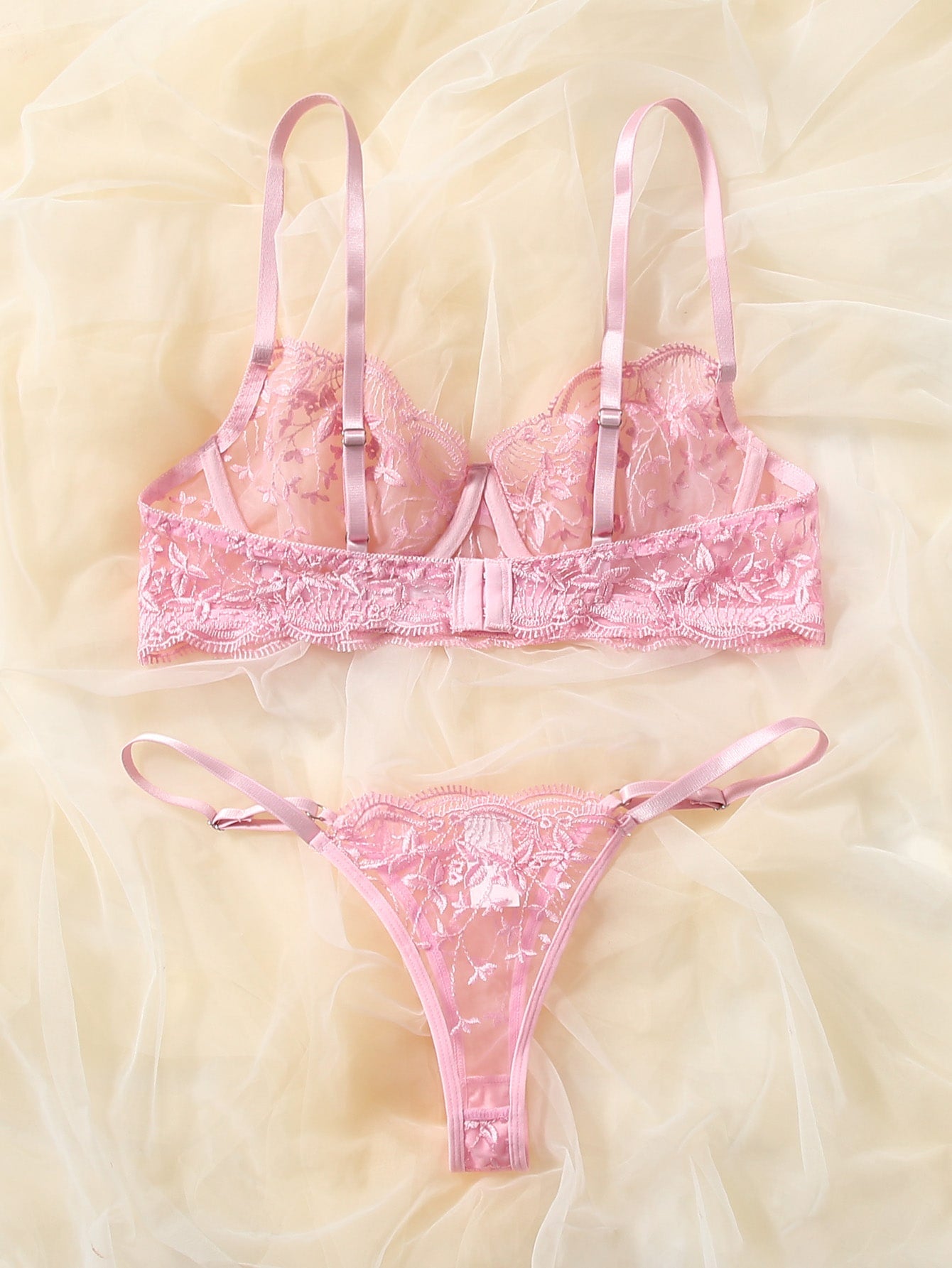 Pink semi-sheer mesh lingerie set with leaf embroidery, underwire demi bra, adjustable spaghetti straps, and matching low-rise V-string panty