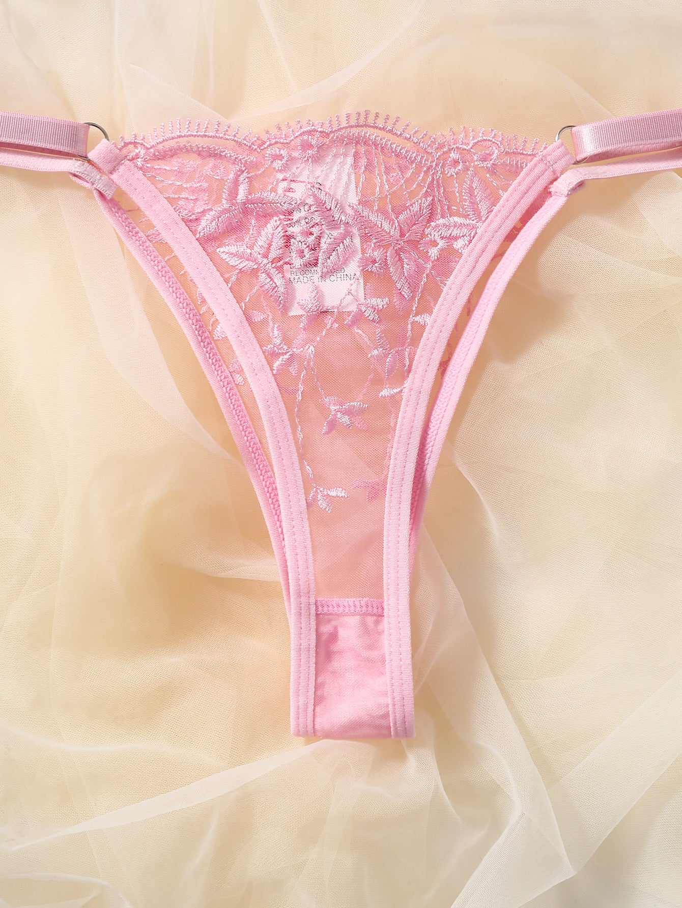 Pink semi-sheer mesh lingerie set with leaf embroidery, underwire demi bra, adjustable spaghetti straps, and matching low-rise V-string panty