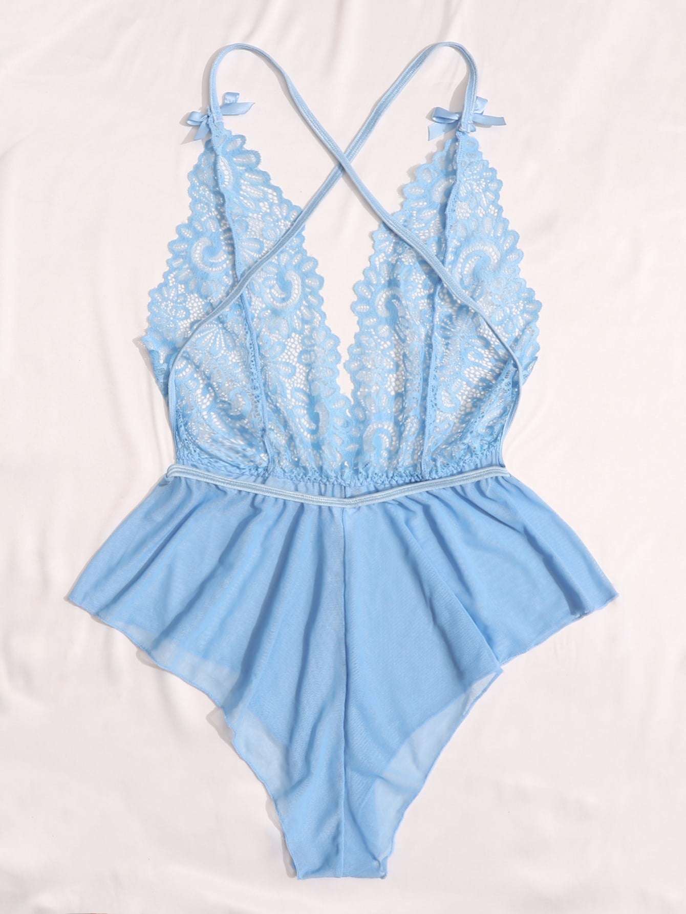 Sheer mesh teddy bodysuit lingerie with contrast lace detailing, spaghetti straps, criss-cross back, backless design, bow accent, and V-string cut.