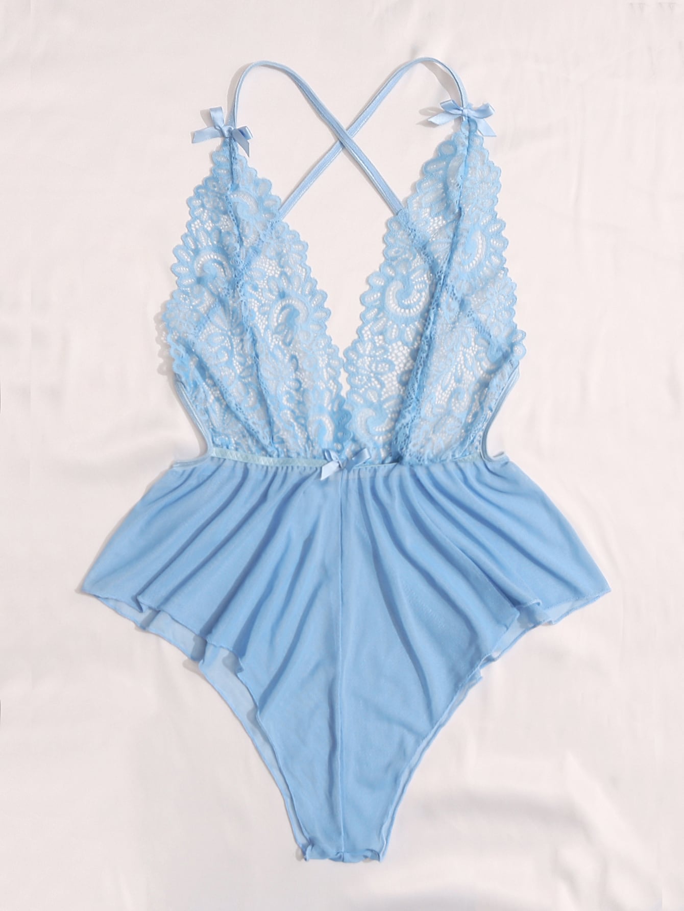 Sheer mesh teddy bodysuit lingerie with contrast lace detailing, spaghetti straps, criss-cross back, backless design, bow accent, and V-string cut.