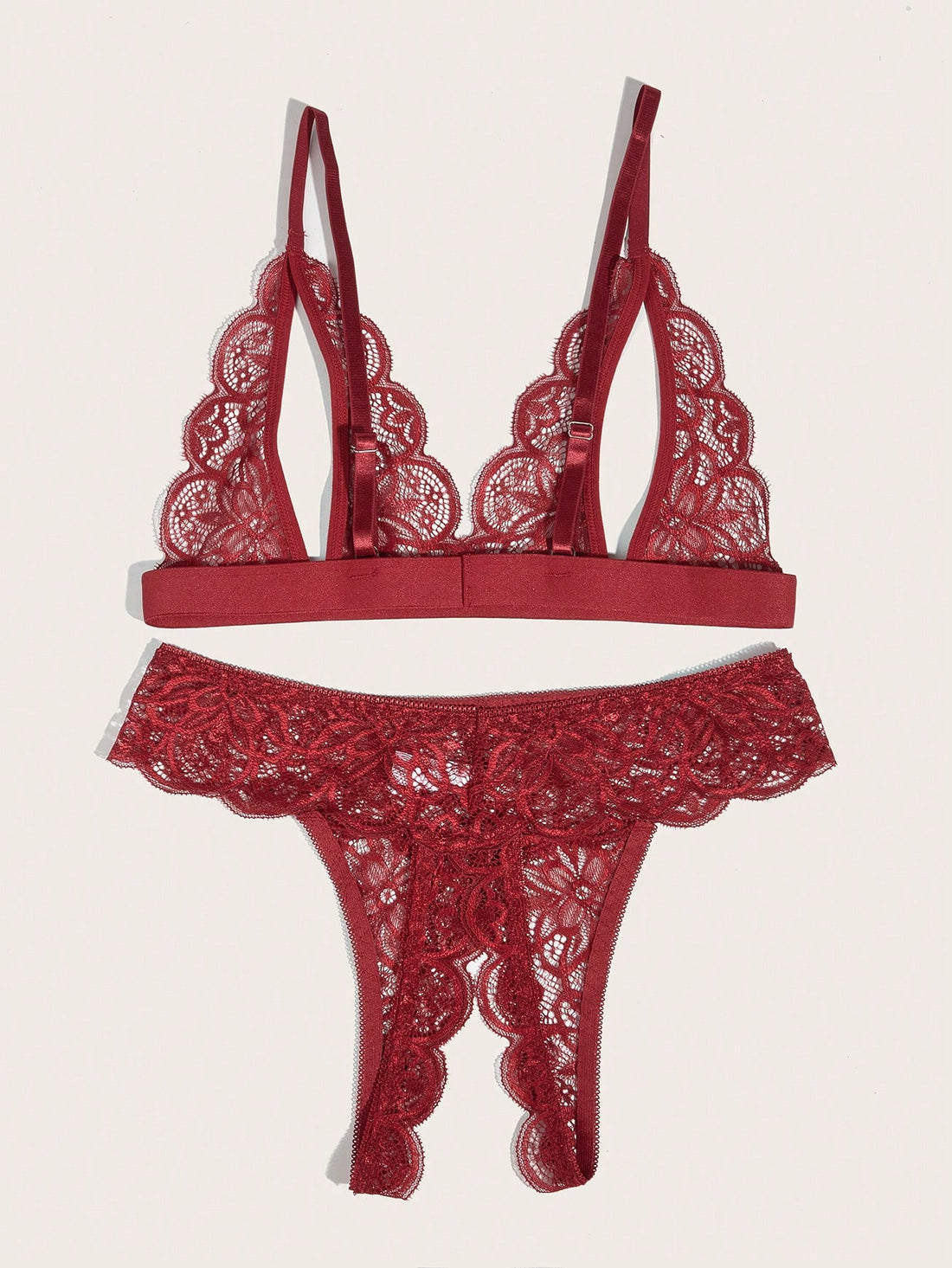 Burgundy floral lace lingerie set with scallop trim, cut-out detail, adjustable spaghetti straps, a bralette-style top, and mid-rise thong bottoms.