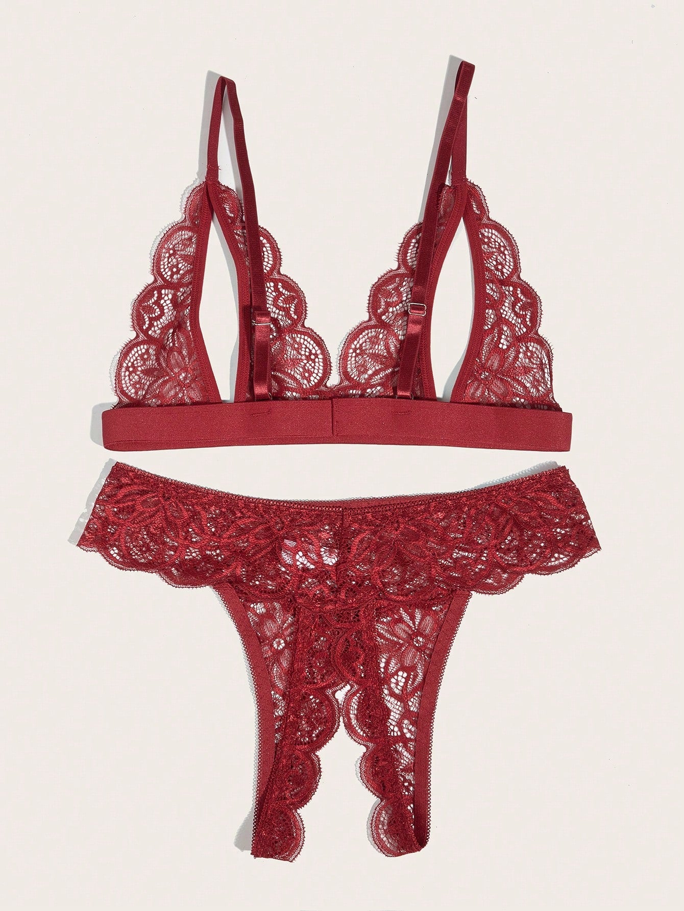 Burgundy floral lace lingerie set with scallop trim, cut-out detail, adjustable spaghetti straps, a bralette-style top, and mid-rise thong bottoms.