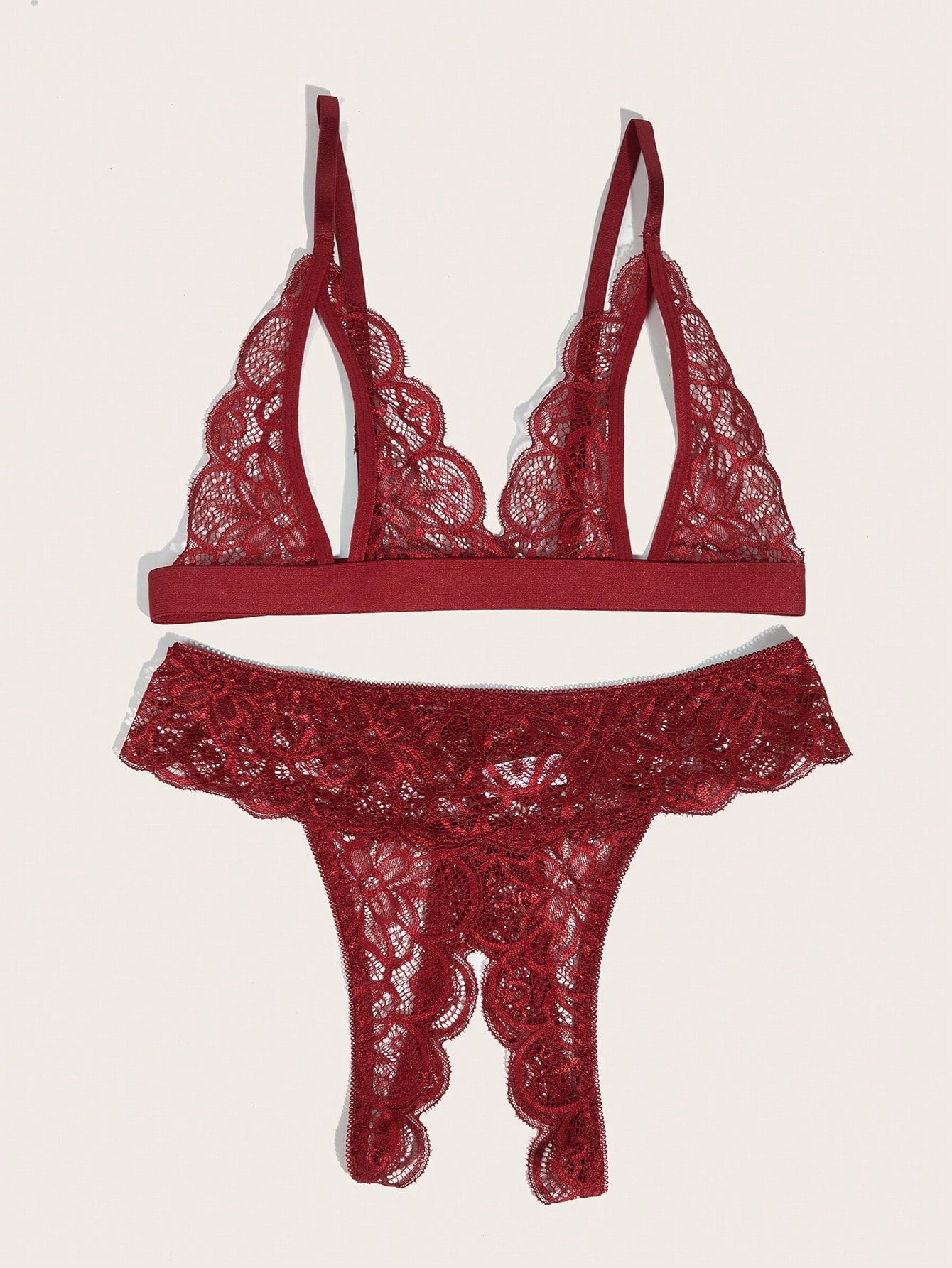 Burgundy floral lace lingerie set with scallop trim, cut-out detail, adjustable spaghetti straps, a bralette-style top, and mid-rise thong bottoms.