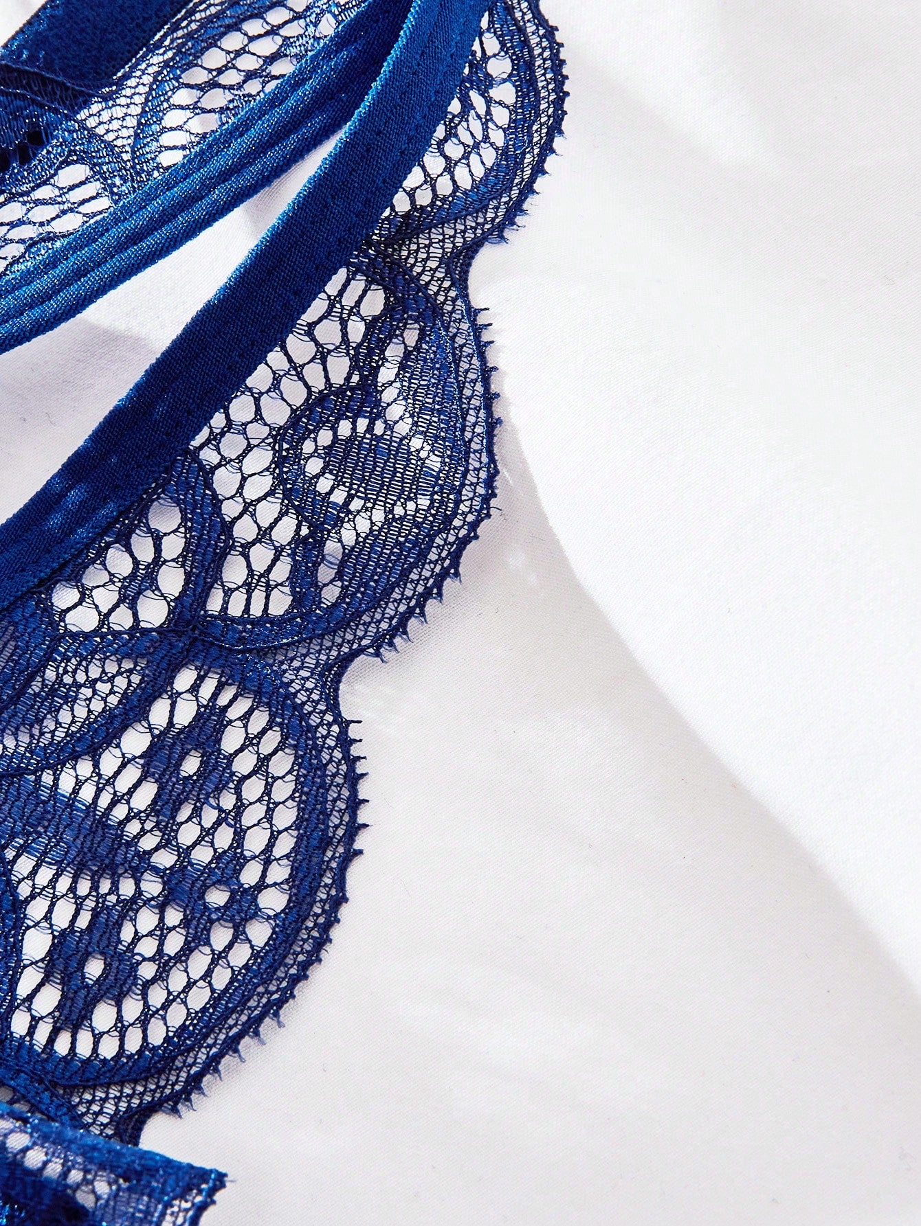 Burgundy floral lace lingerie set with scallop trim, cut-out detail, adjustable spaghetti straps, a bralette-style top, and mid-rise thong bottoms.