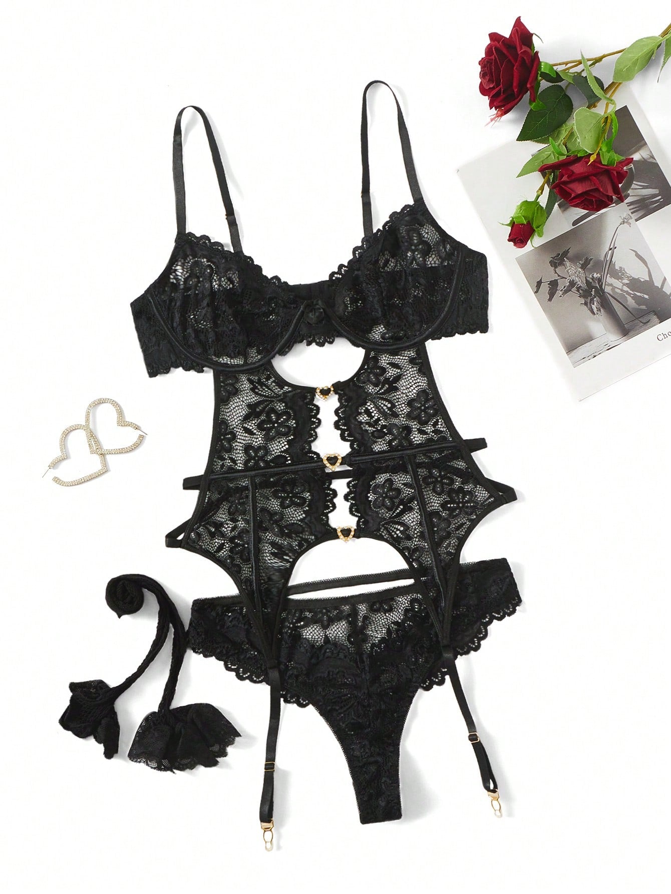 Women’s 4-piece floral lace lingerie set featuring a cut-out design, rhinestone detail, and an underwire corset with spaghetti straps and matching low-rise briefs.