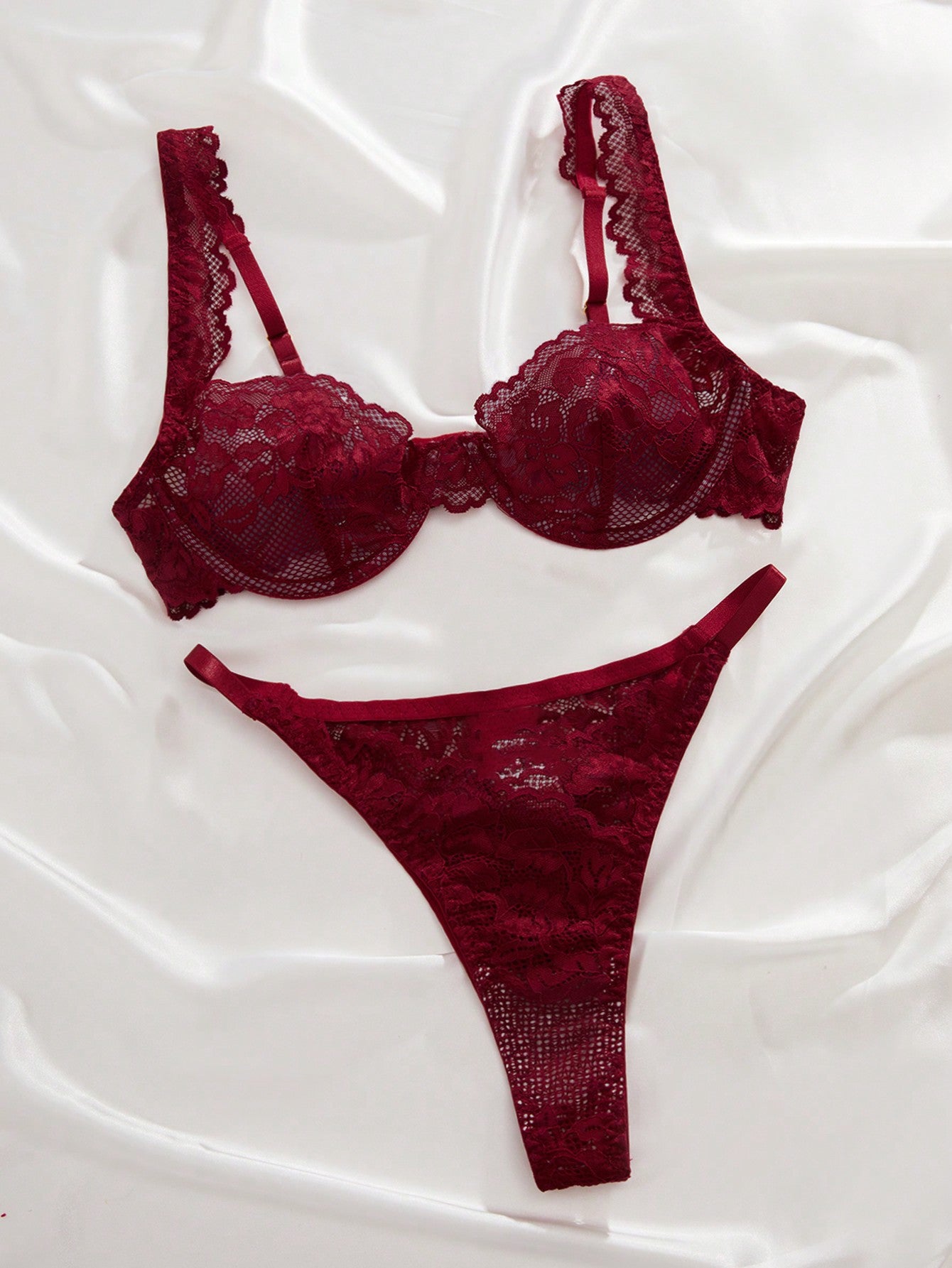 Two-piece floral lace lingerie set featuring an underwire bra with adjustable straps and a sweetheart neckline, paired with a low-rise thong.