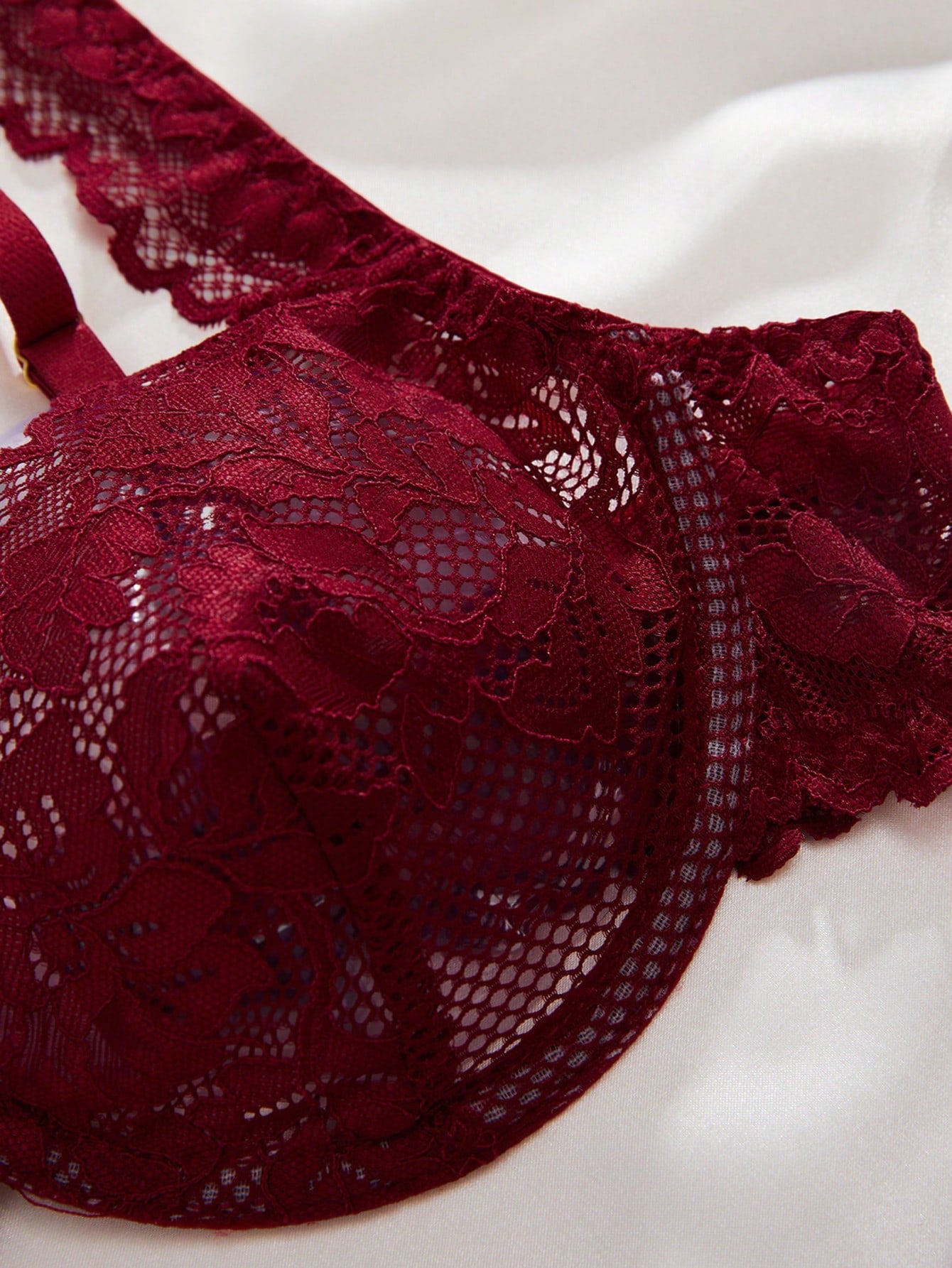 Two-piece floral lace lingerie set featuring an underwire bra with adjustable straps and a sweetheart neckline, paired with a low-rise thong.