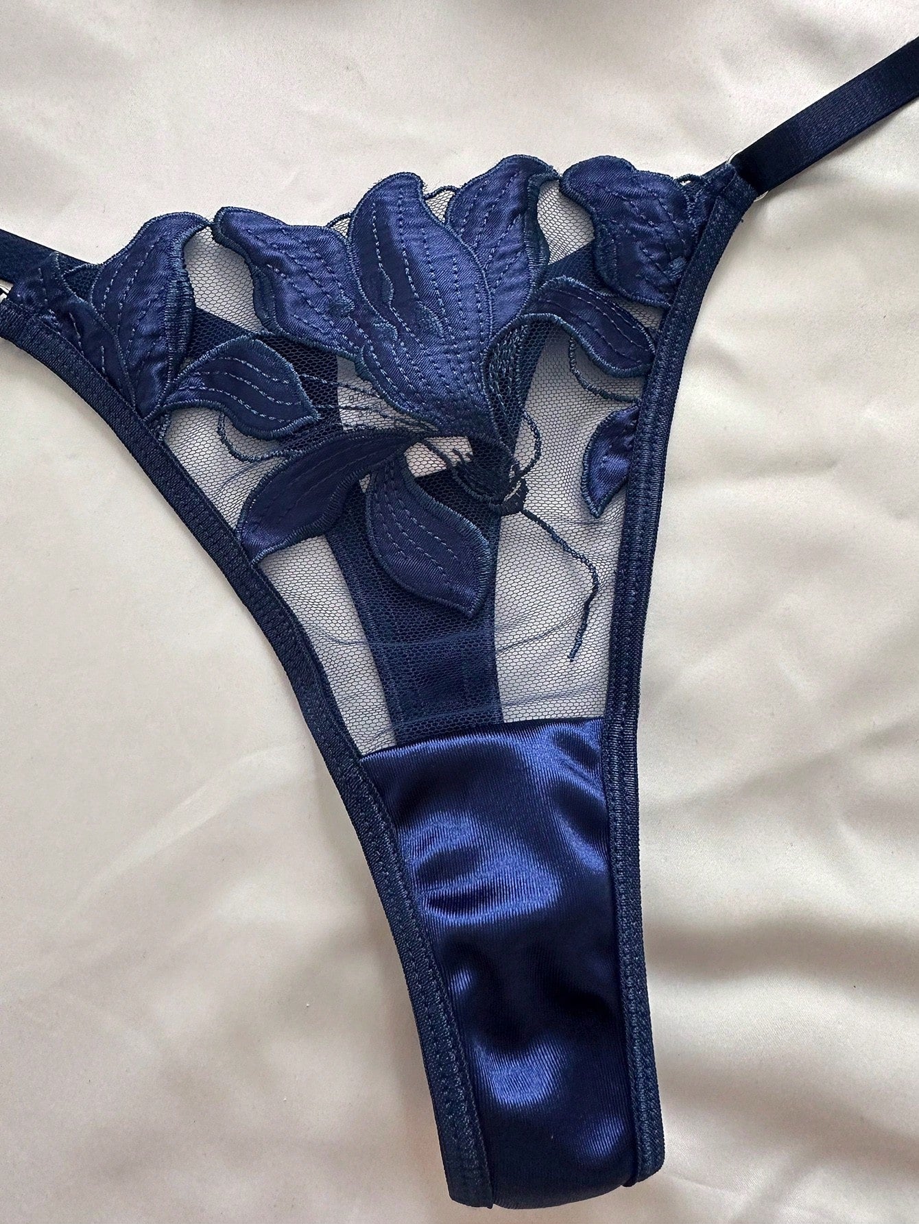 Women’s 2-piece sexy lingerie set featuring an embroidered sheer mesh demi bra with adjustable spaghetti straps and a matching low-rise thong.