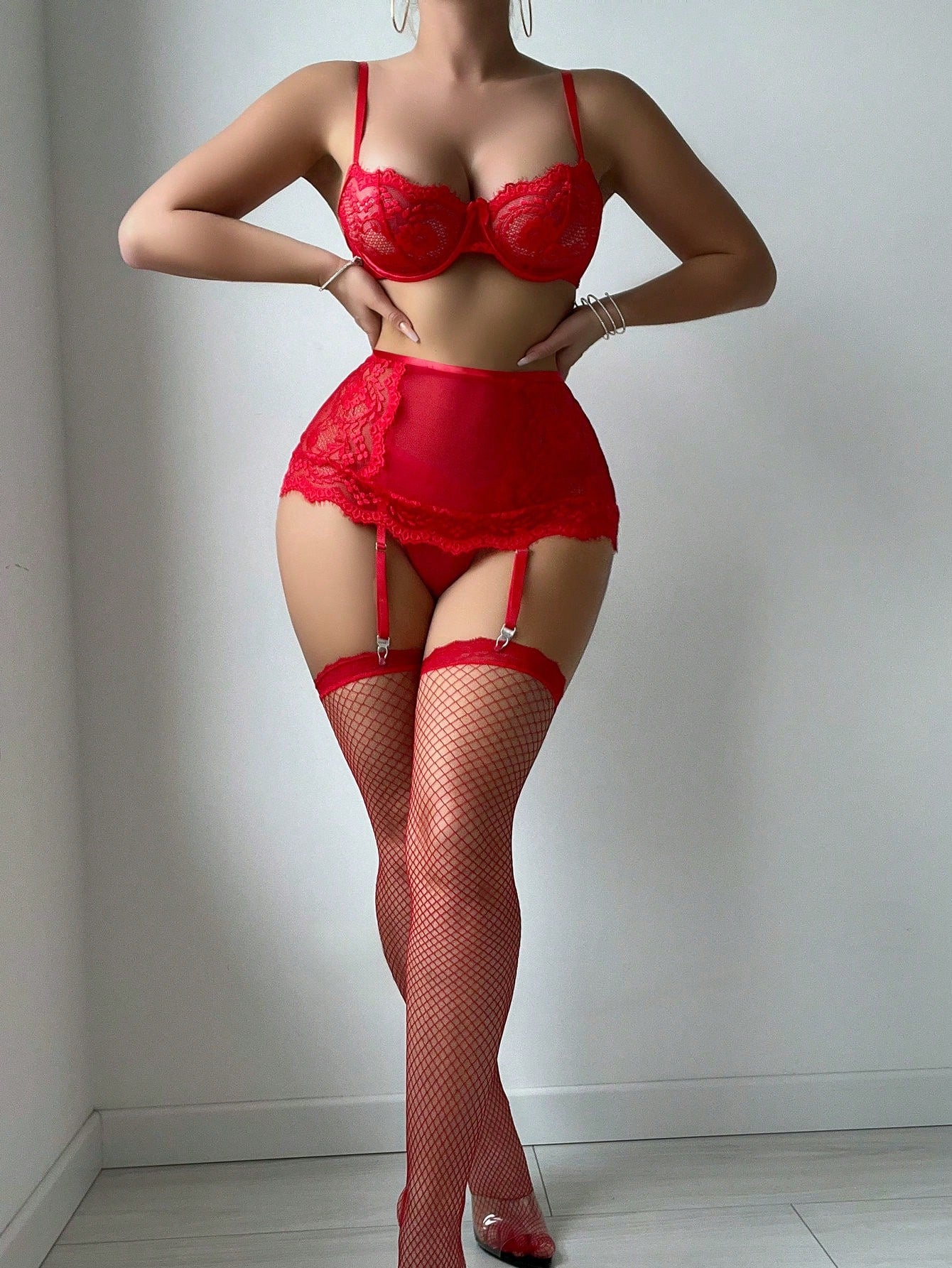 Women’s 5-piece lace lingerie set including an underwire bra with adjustable spaghetti straps, garter belt, thong, and two pairs of stockings; plain pattern with contrast lace and slight stretch, available in red and white.
