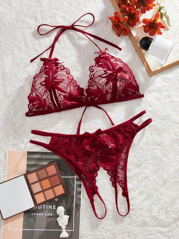 Burgundy floral lace 2-piece lingerie set with a bralette top and low-rise briefs, featuring a cut-out crotchless design, spaghetti straps, and adjustable straps.