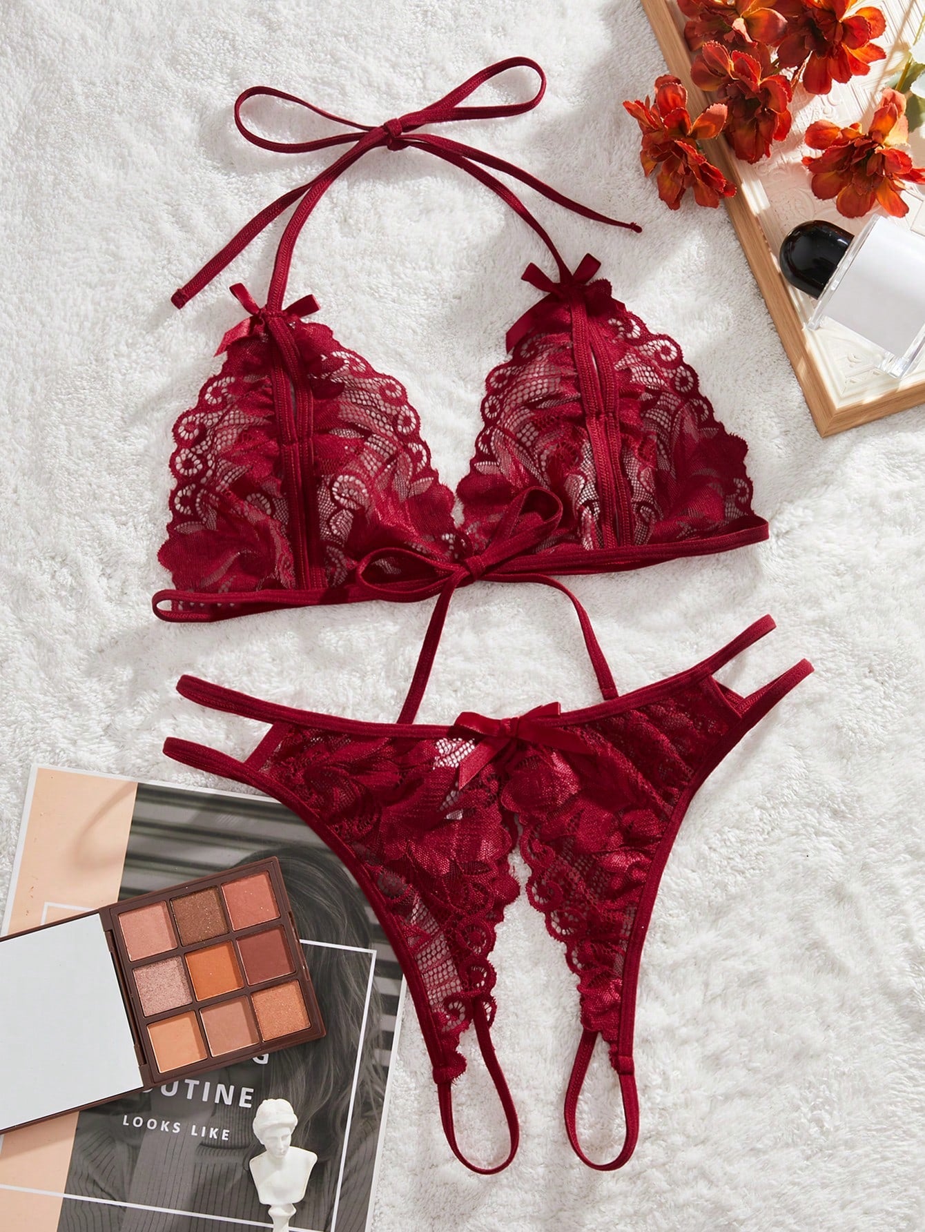 Burgundy floral lace 2-piece lingerie set with a bralette top and low-rise briefs, featuring a cut-out crotchless design, spaghetti straps, and adjustable straps.