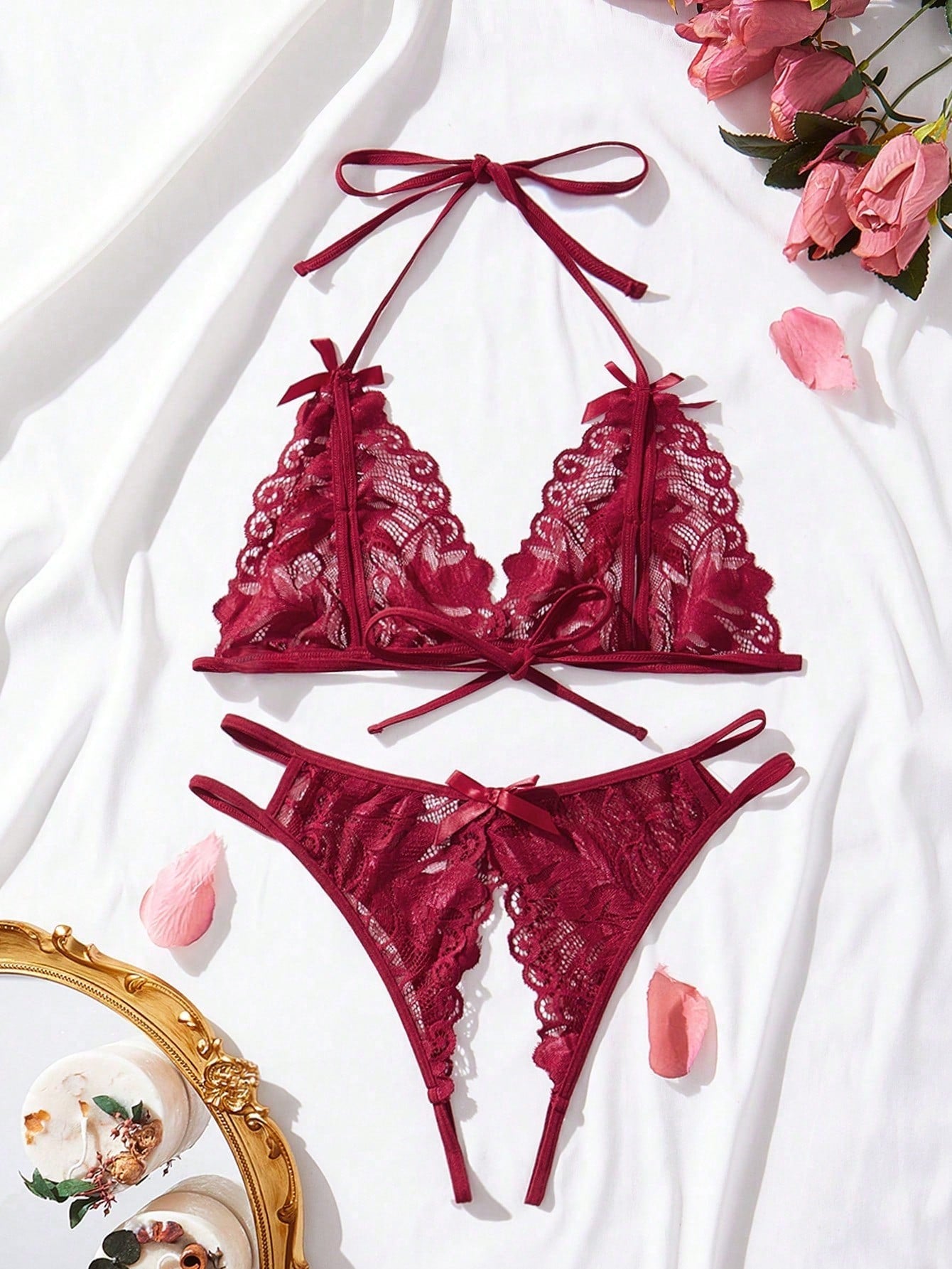 Burgundy floral lace 2-piece lingerie set with a bralette top and low-rise briefs, featuring a cut-out crotchless design, spaghetti straps, and adjustable straps.