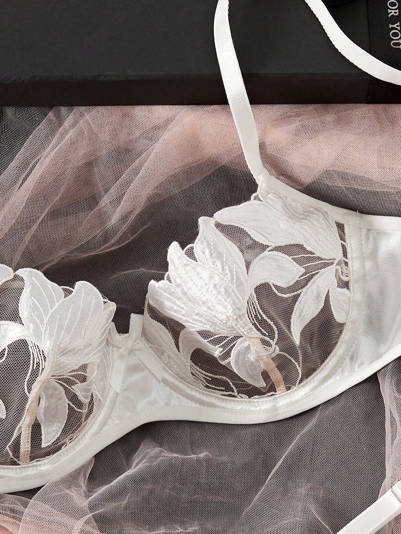 Women’s 2-piece sexy lingerie set featuring an embroidered sheer mesh demi bra with adjustable spaghetti straps and a matching low-rise thong.