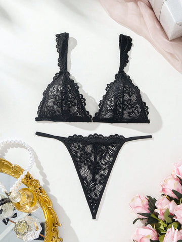 Black lace lingerie set featuring a triangle bra with adjustable spaghetti straps and matching mid-rise V-string thong briefs with scallop detailing and plant pattern.