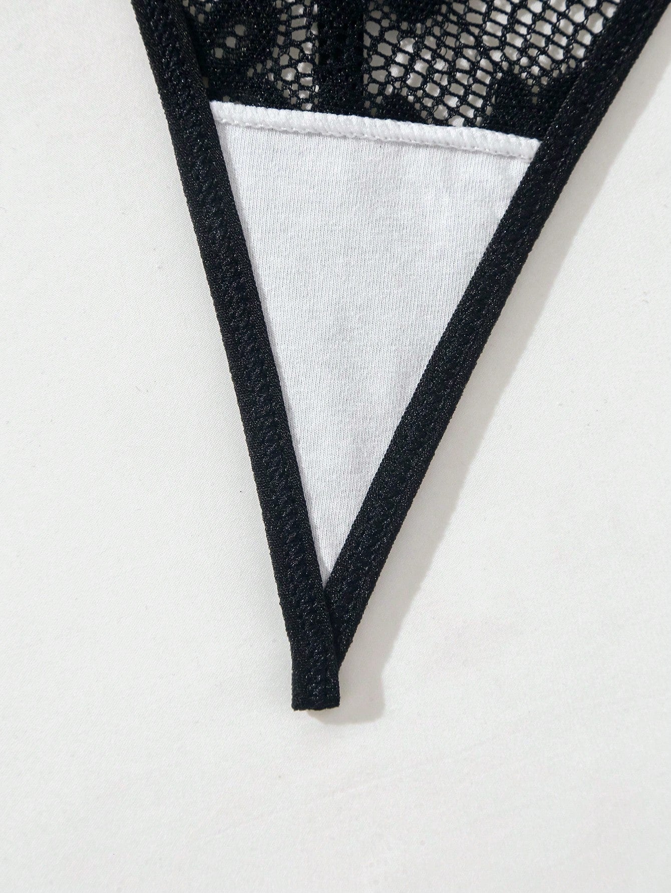 Black lace lingerie set featuring a triangle bra with adjustable spaghetti straps and matching mid-rise V-string thong briefs with scallop detailing and plant pattern.