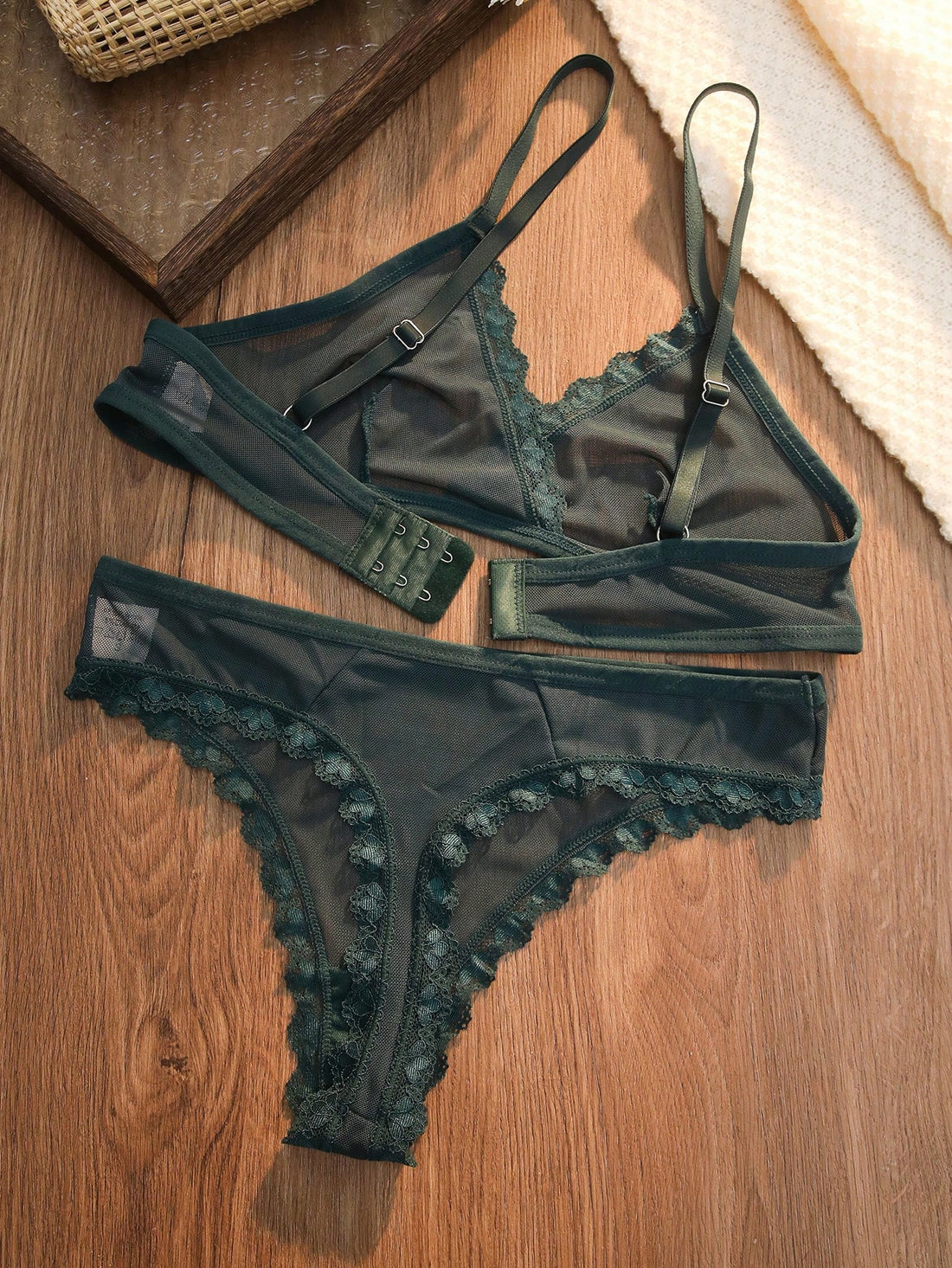 Dark green 2-piece lingerie set featuring a lace and mesh underwire bralette with adjustable straps and a matching mid-rise thong.