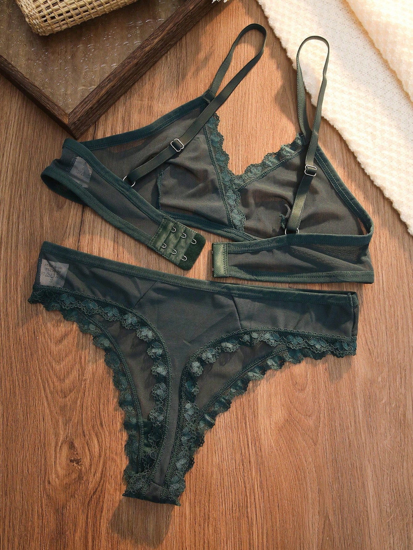Dark green 2-piece lingerie set featuring a lace and mesh underwire bralette with adjustable straps and a matching mid-rise thong.