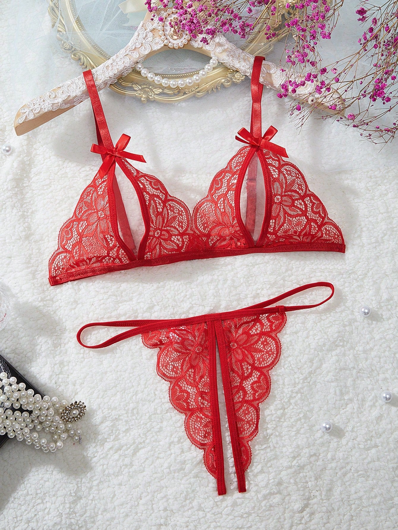 Two-piece floral lace cut-out lingerie set featuring a spaghetti strap bralette with adjustable straps and a matching low-rise V-string panty.