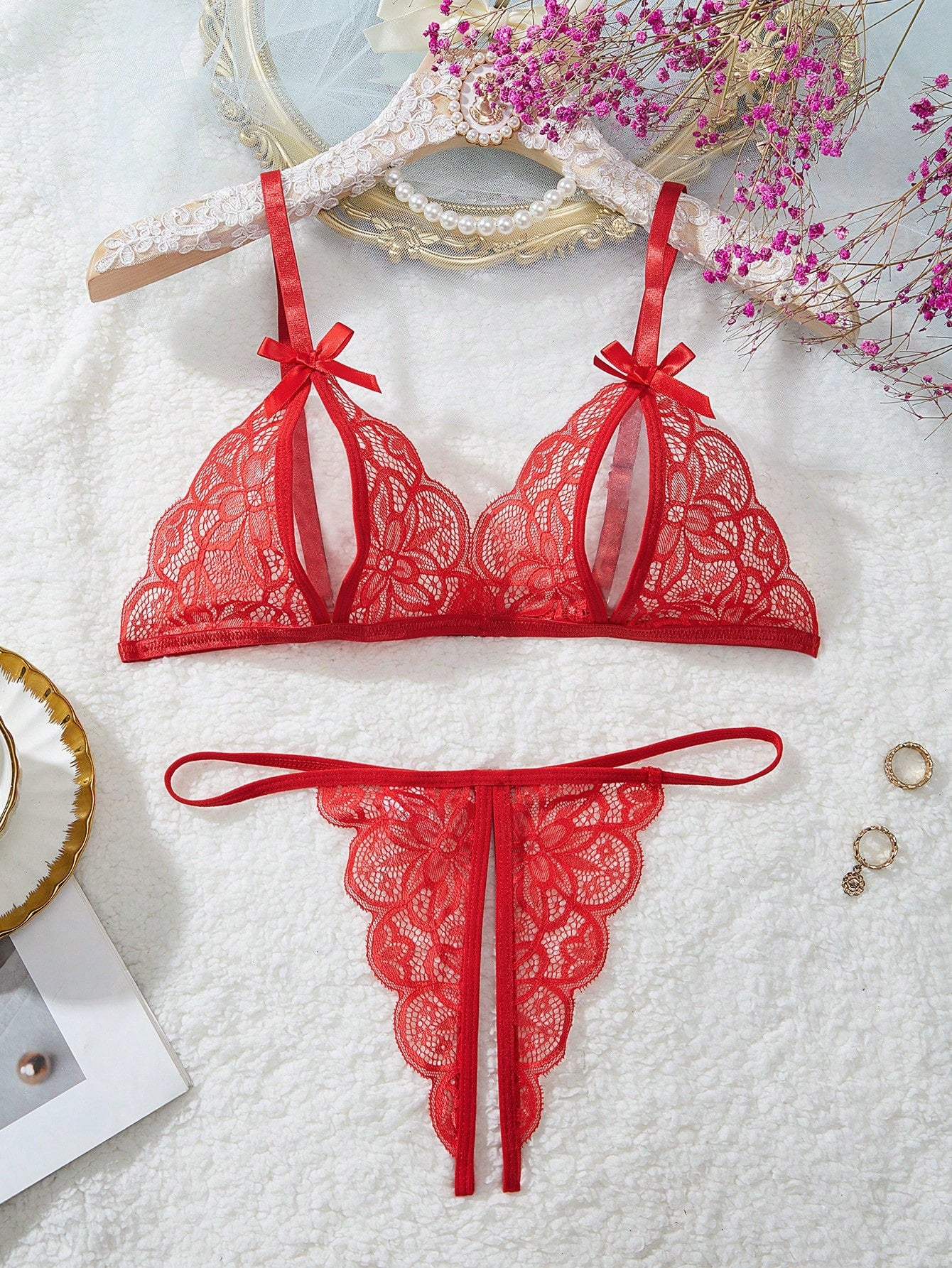 Two-piece women’s sexy lingerie set with a wireless bralette and T-back V-string panties, featuring bowknot decoration, hollow-out detailing, and contrast lace accents with adjustable spaghetti straps.