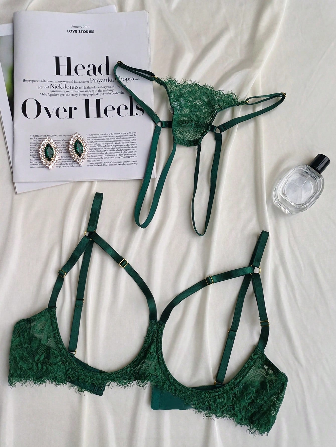 Two-piece goth-style floral lace lingerie set featuring a triangle bra with adjustable spaghetti straps, cut-out harness detailing, and a matching mid-rise thong.