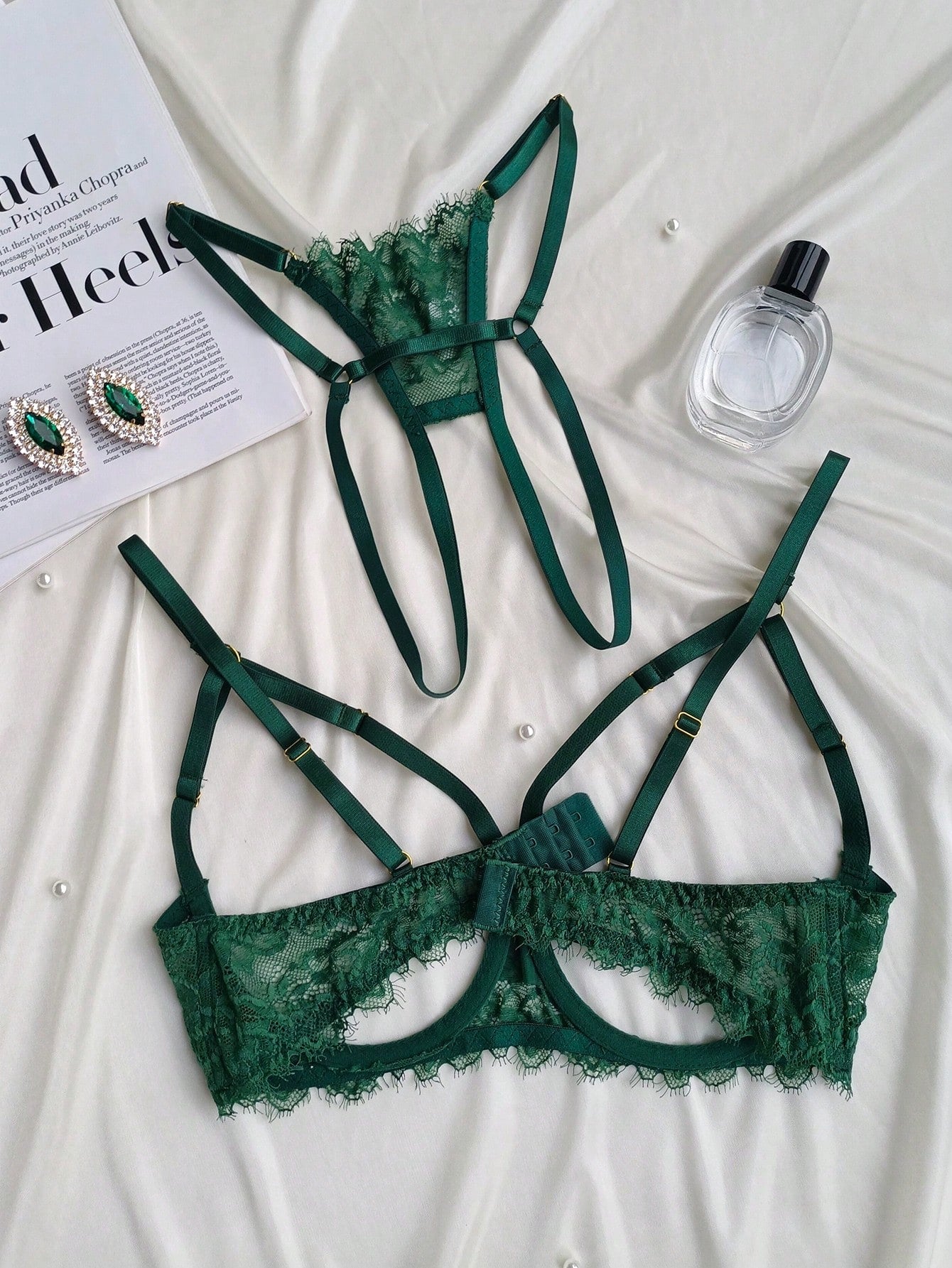 Two-piece goth-style floral lace lingerie set featuring a triangle bra with adjustable spaghetti straps, cut-out harness detailing, and a matching mid-rise thong.