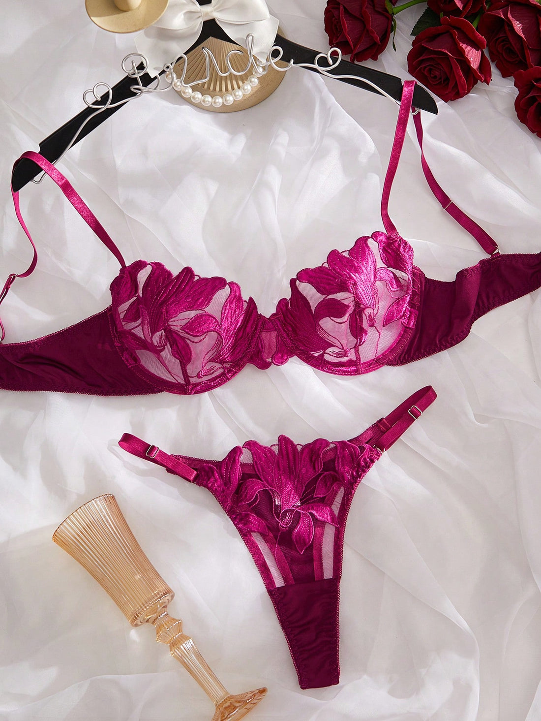 Purple 2-piece women’s lingerie set with embroidered floral details, featuring an underwire bra with adjustable straps and a matching low-rise thong in semi-sheer mesh.