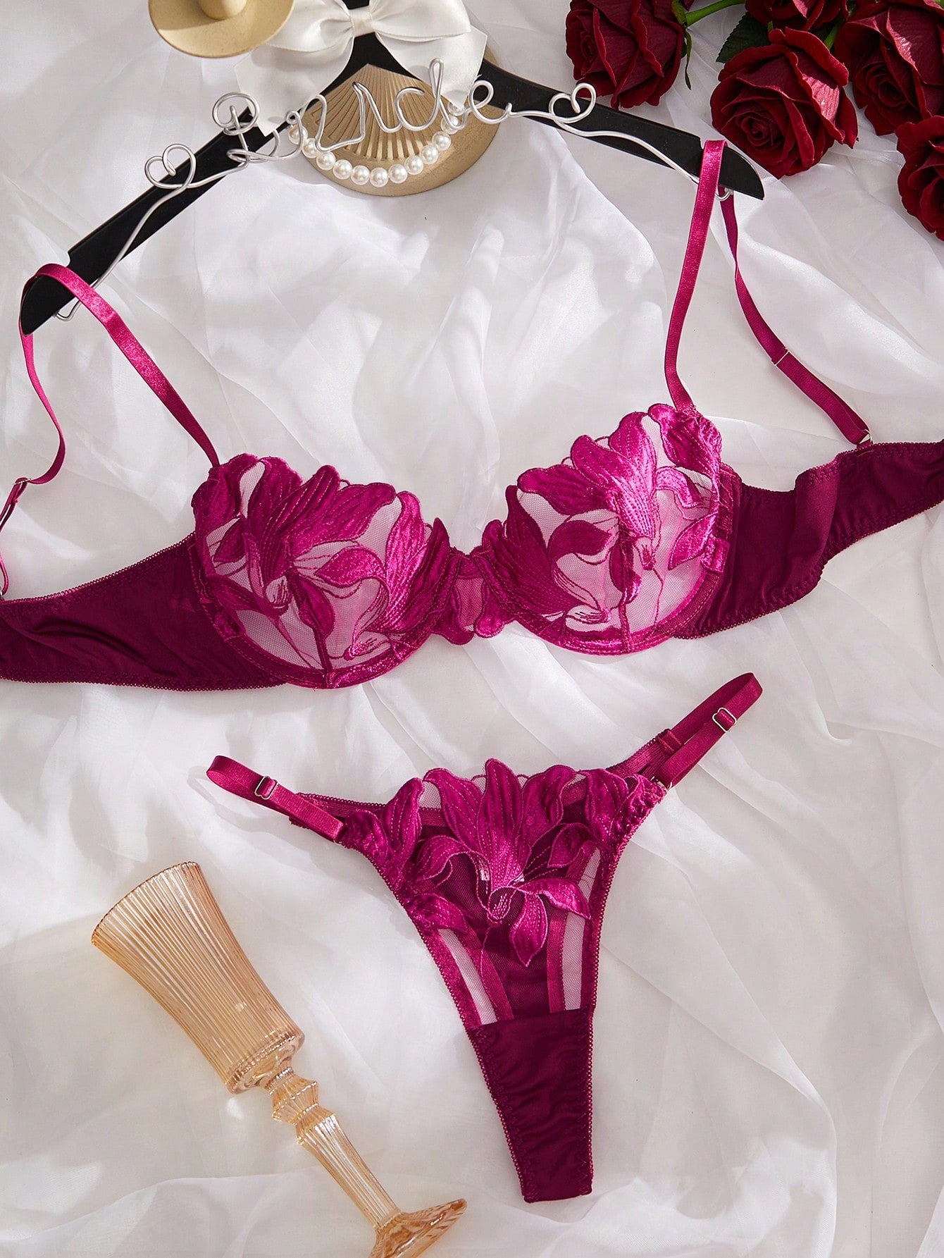 Purple 2-piece women’s lingerie set with embroidered floral details, featuring an underwire bra with adjustable straps and a matching low-rise thong in semi-sheer mesh.
