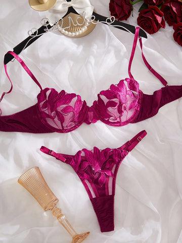 Purple 2-piece women’s lingerie set with embroidered floral details, featuring an underwire bra with adjustable straps and a matching low-rise thong in semi-sheer mesh.
