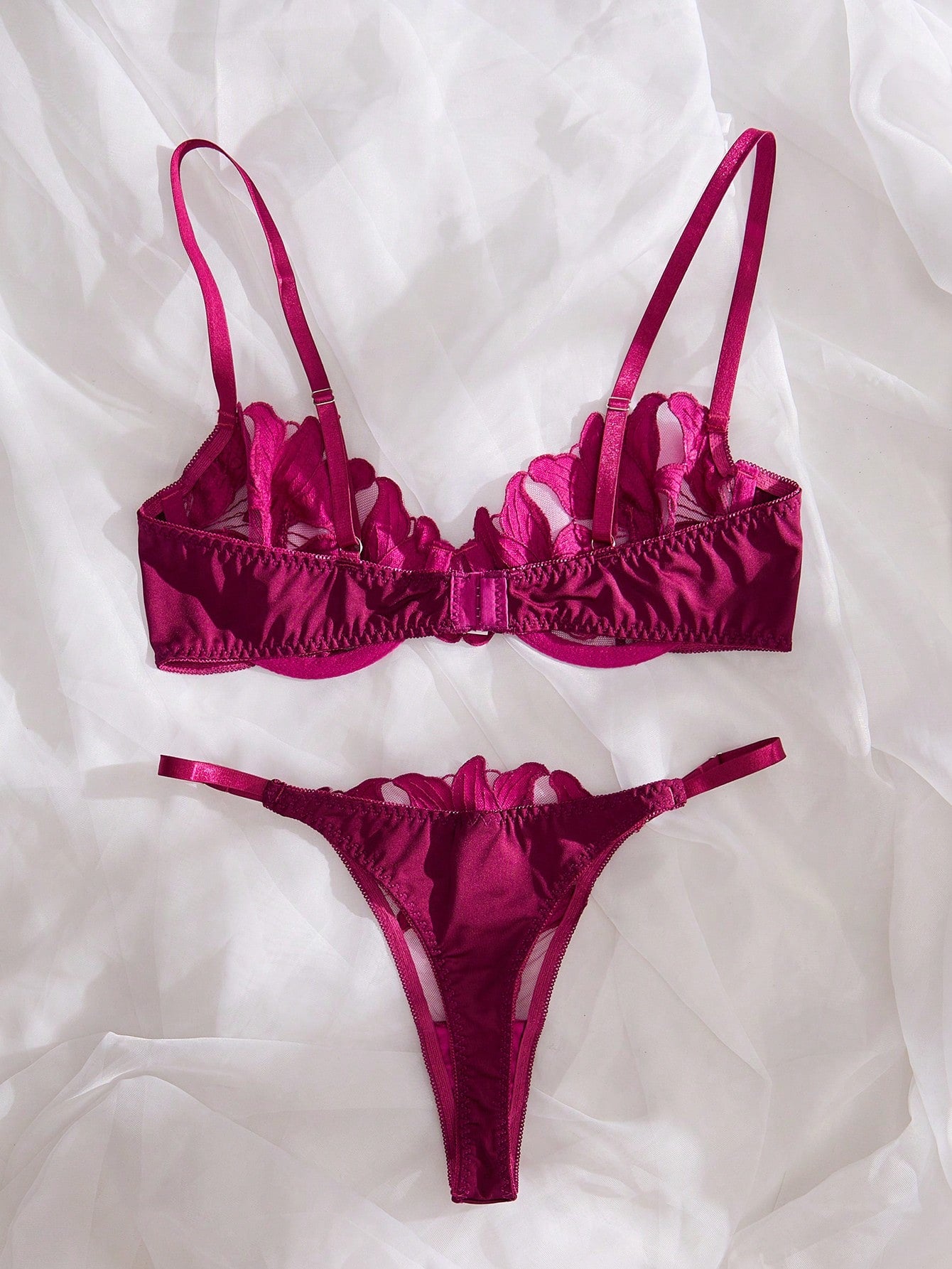 Purple 2-piece women’s lingerie set with embroidered floral details, featuring an underwire bra with adjustable straps and a matching low-rise thong in semi-sheer mesh.