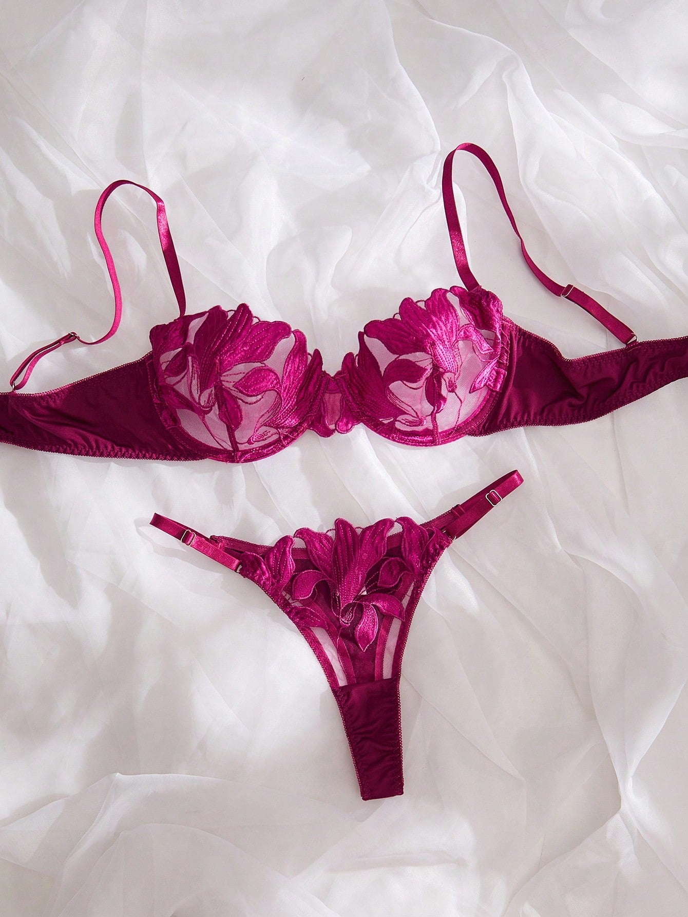 Purple 2-piece women’s lingerie set with embroidered floral details, featuring an underwire bra with adjustable straps and a matching low-rise thong in semi-sheer mesh.