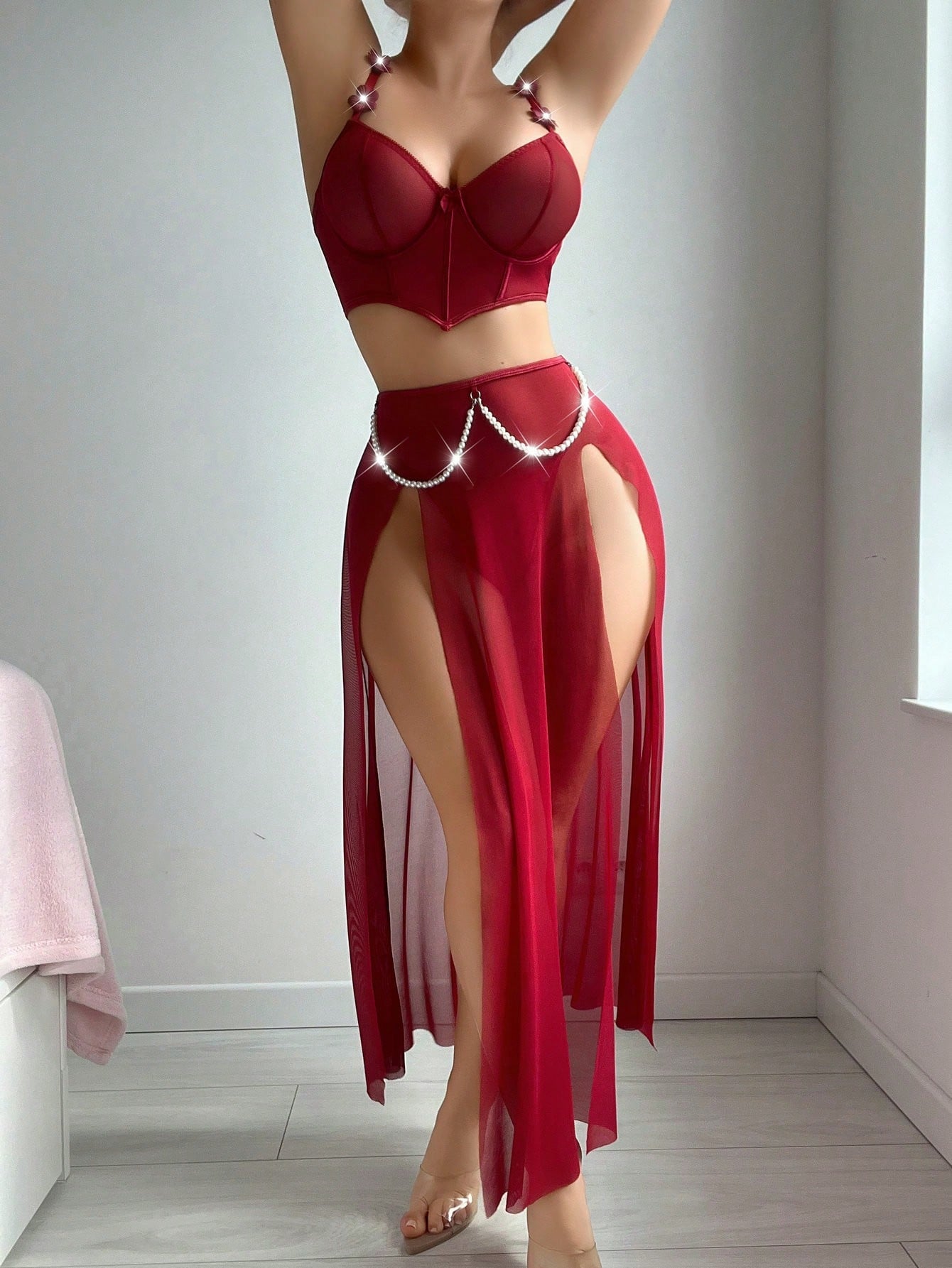 Three-piece vintage-inspired lingerie set with faux pearl and fishbone detailing, featuring a split longline spaghetti strap top with underwire and adjustable straps, matching skirt, and thong in plain mesh fabric.