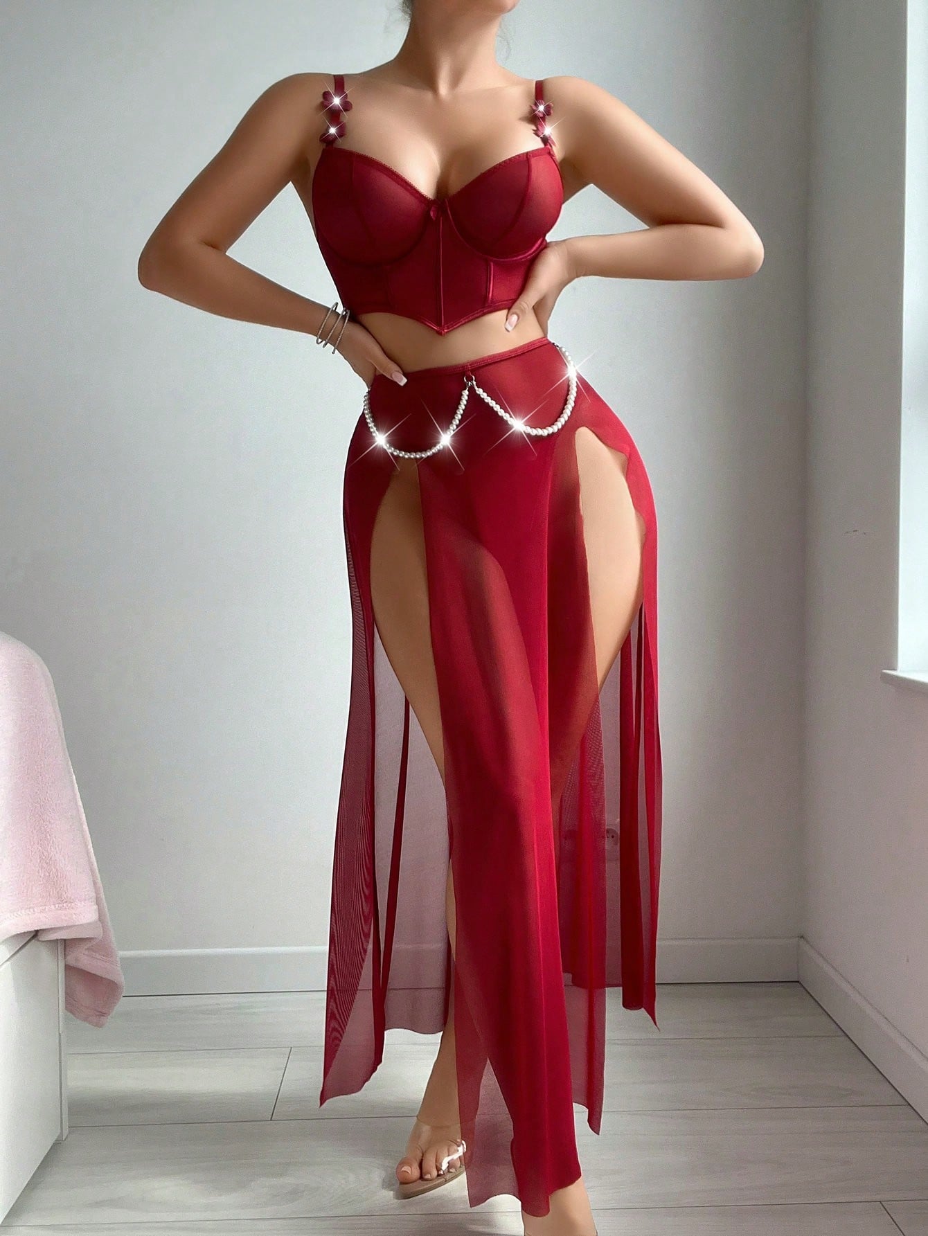Three-piece vintage-inspired lingerie set with faux pearl and fishbone detailing, featuring a split longline spaghetti strap top with underwire and adjustable straps, matching skirt, and thong in plain mesh fabric.