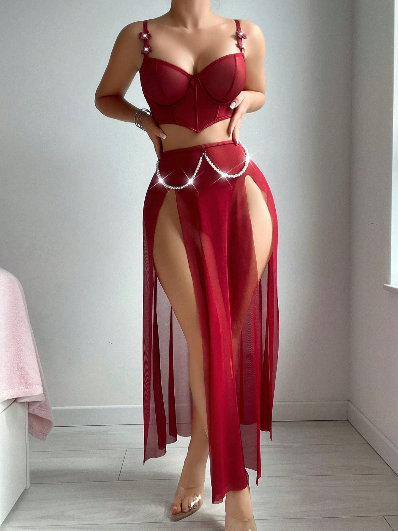 Three-piece vintage-inspired lingerie set with faux pearl and fishbone detailing, featuring a split longline spaghetti strap top with underwire and adjustable straps, matching skirt, and thong in plain mesh fabric.