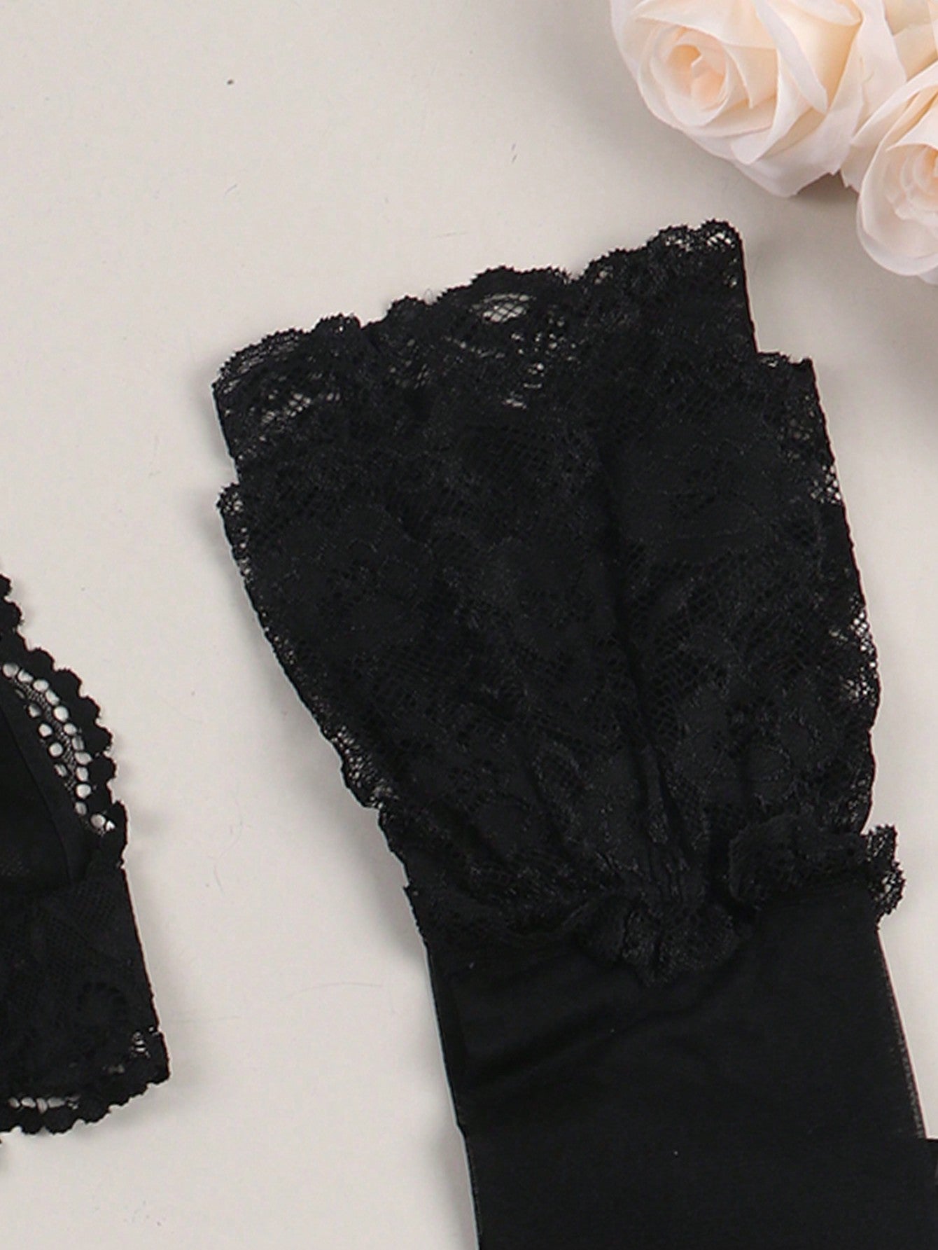 Women’s floral lace garter lingerie 4-piece set with a plunge wireless bra, adjustable straps, low-rise hipster panty, and cut-out details.