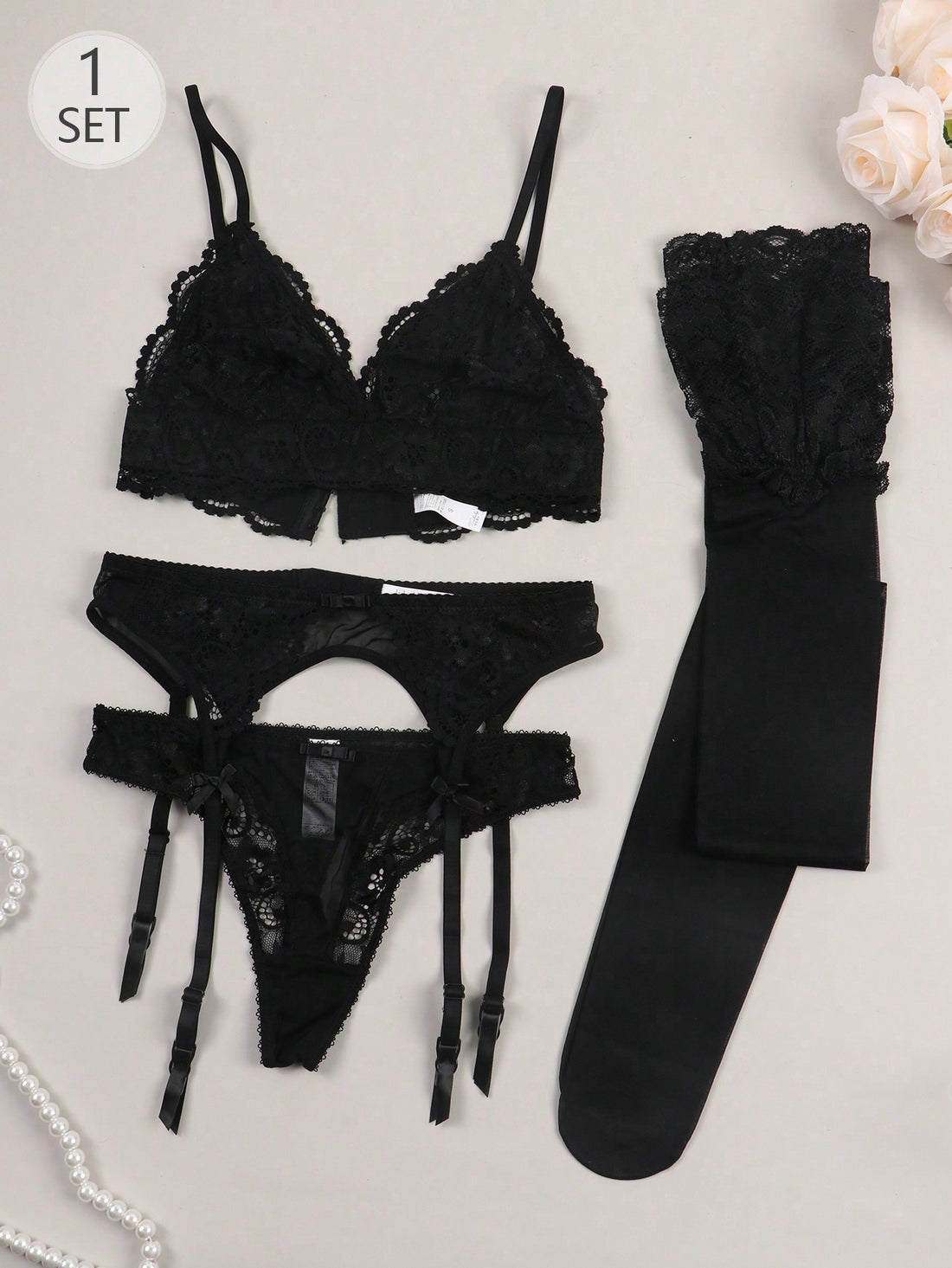 Women’s floral lace garter lingerie 4-piece set with a plunge wireless bra, adjustable straps, low-rise hipster panty, and cut-out details.