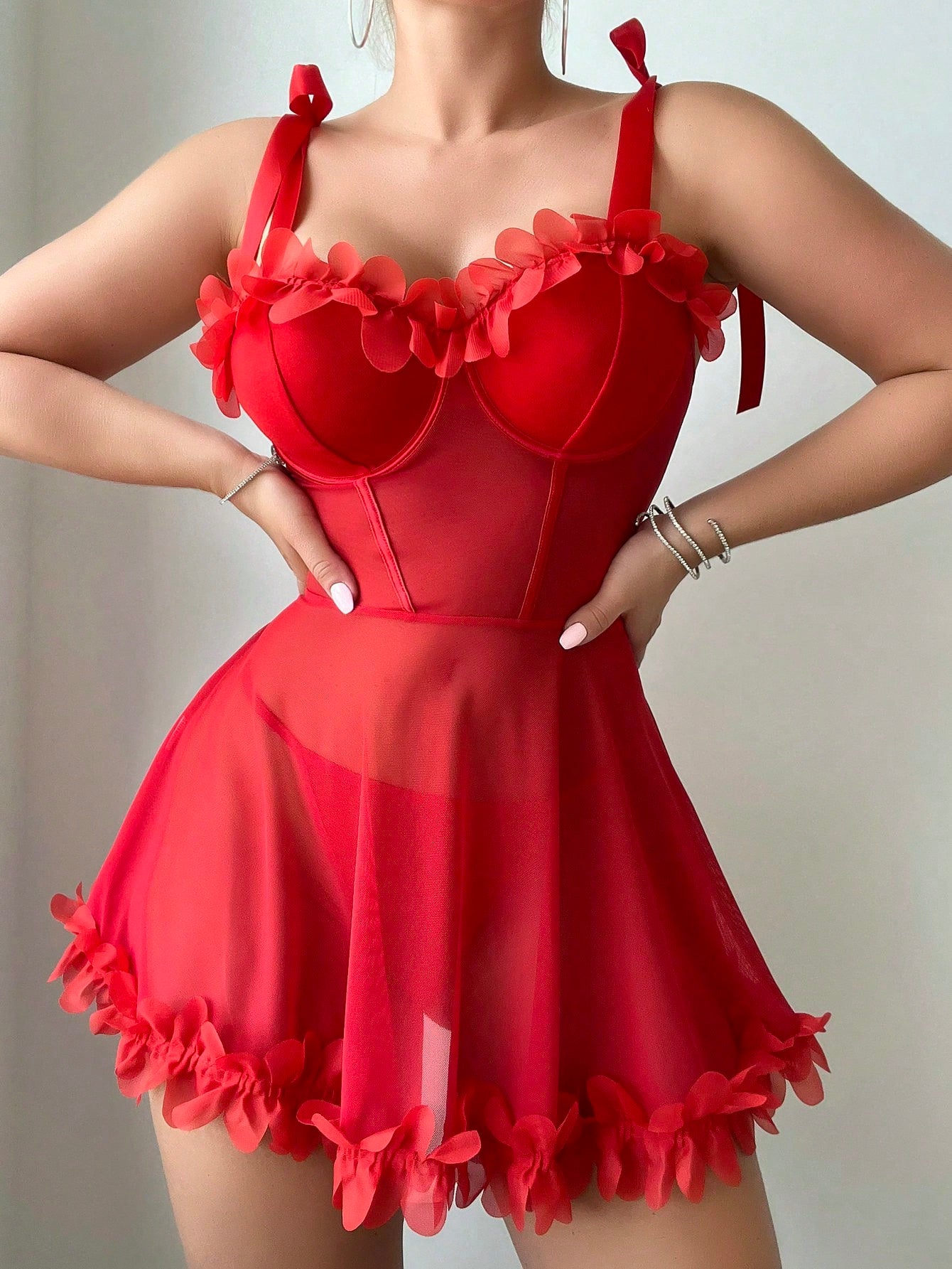 2-piece mesh floral print lingerie set featuring an underwire bra-style camisole with adjustable spaghetti straps and a matching thong.