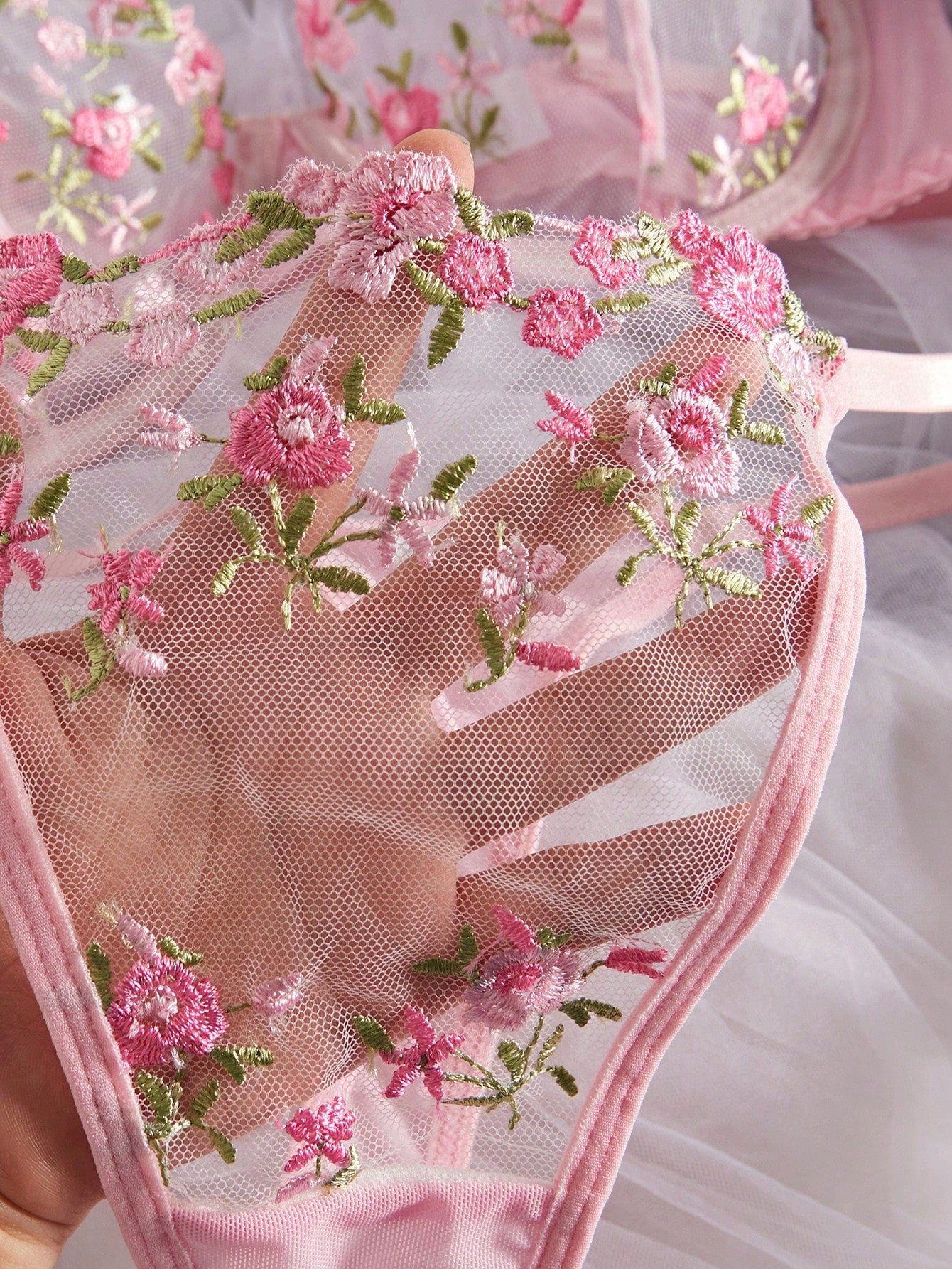 Women's floral embroidered sheer mesh lingerie set featuring a spaghetti strap camisole-style bralette with adjustable straps and a matching low-rise thong.