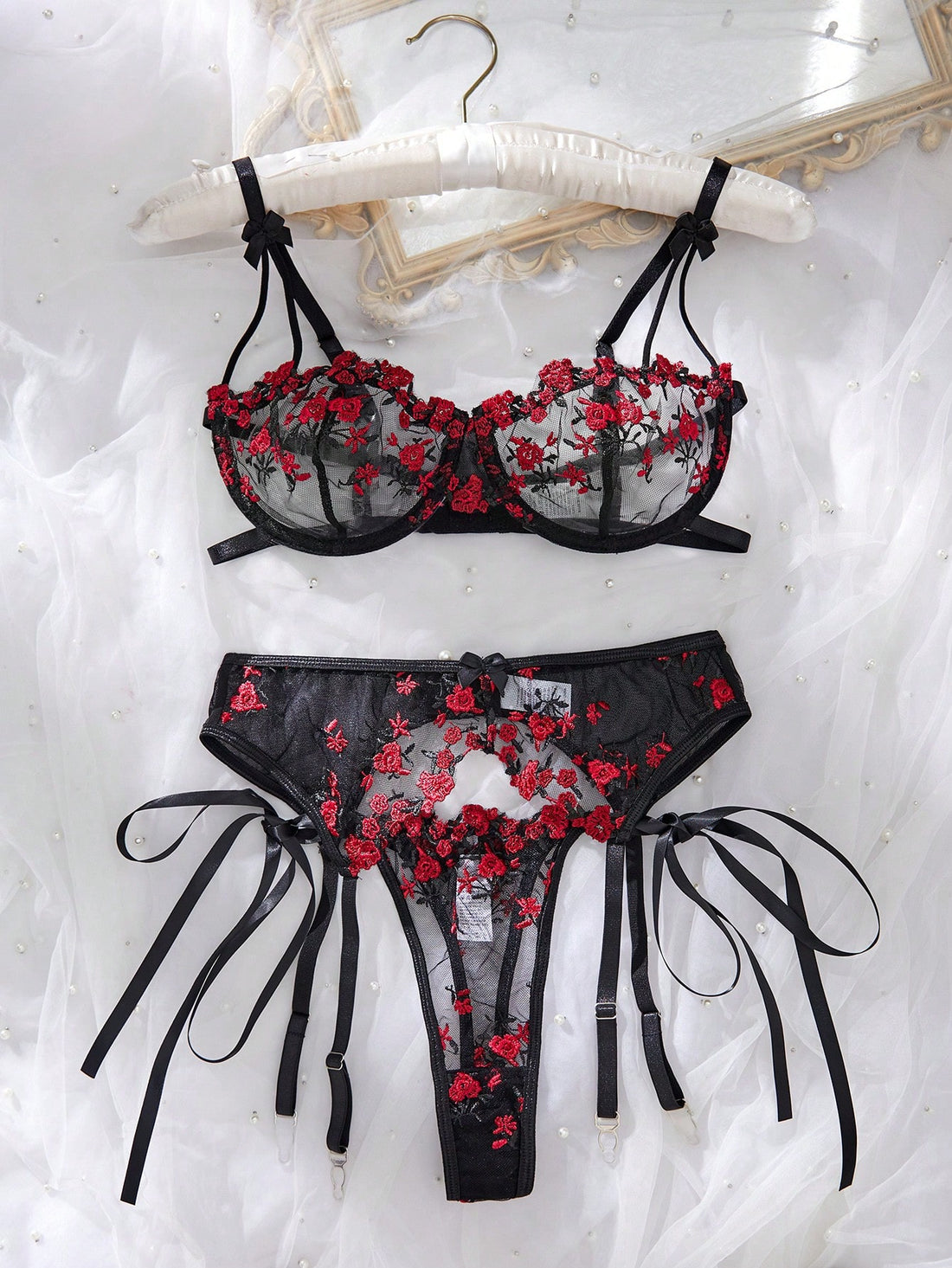 3-piece women’s lingerie set featuring a bandeau top and G-string thong, with embroidery, sheer details, knot accents, underwire demi bra styling, and adjustable spaghetti straps.