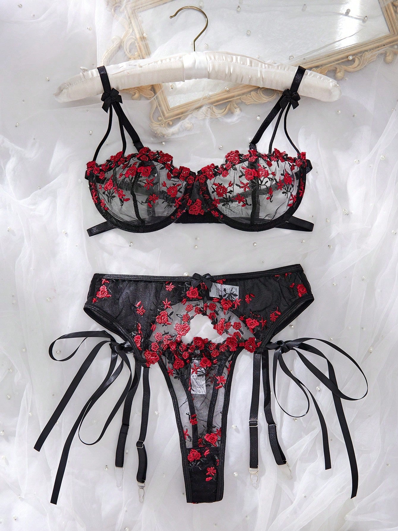 3-piece women’s lingerie set featuring a bandeau top and G-string thong, with embroidery, sheer details, knot accents, underwire demi bra styling, and adjustable spaghetti straps.