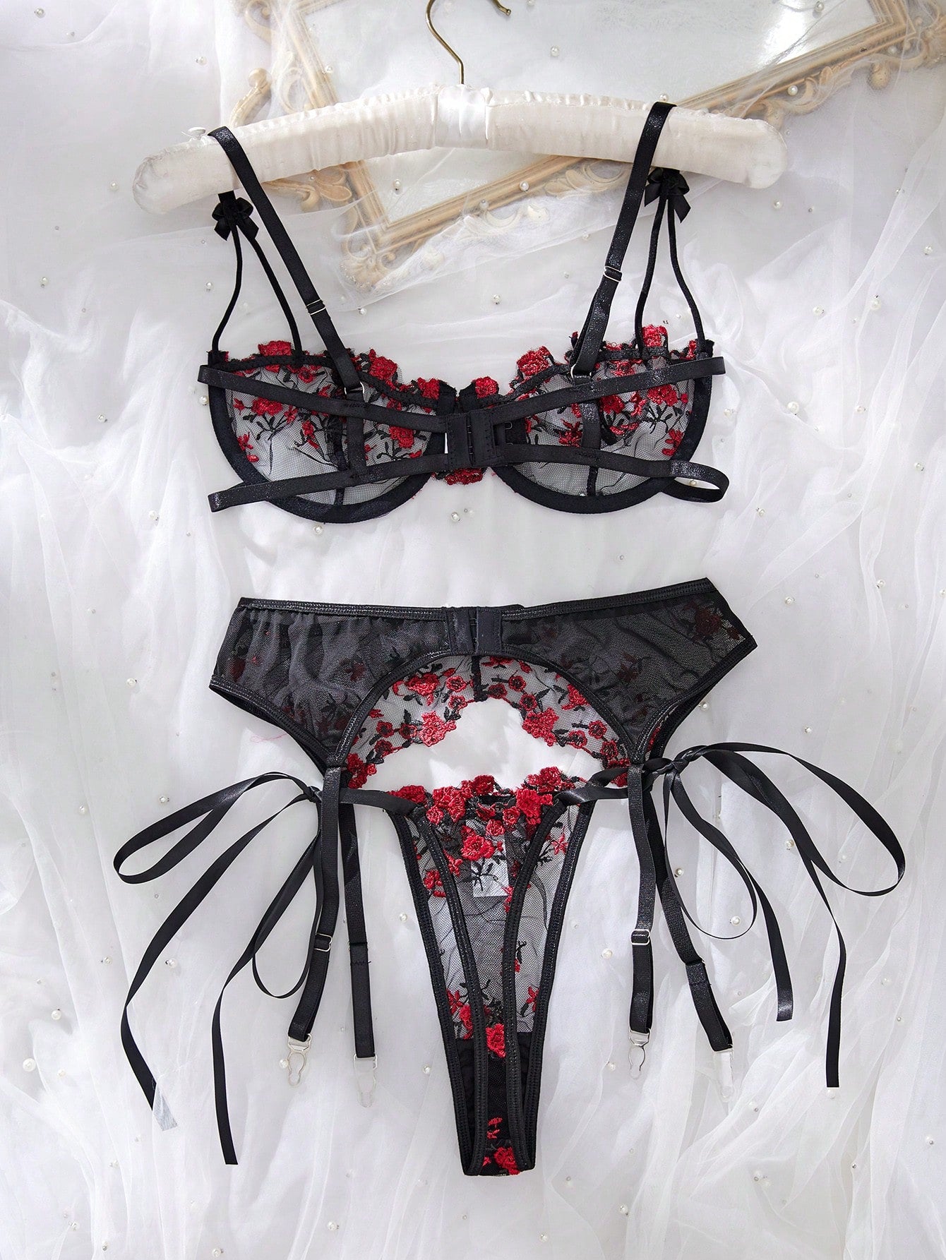 3-piece women’s lingerie set featuring a bandeau top and G-string thong, with embroidery, sheer details, knot accents, underwire demi bra styling, and adjustable spaghetti straps.